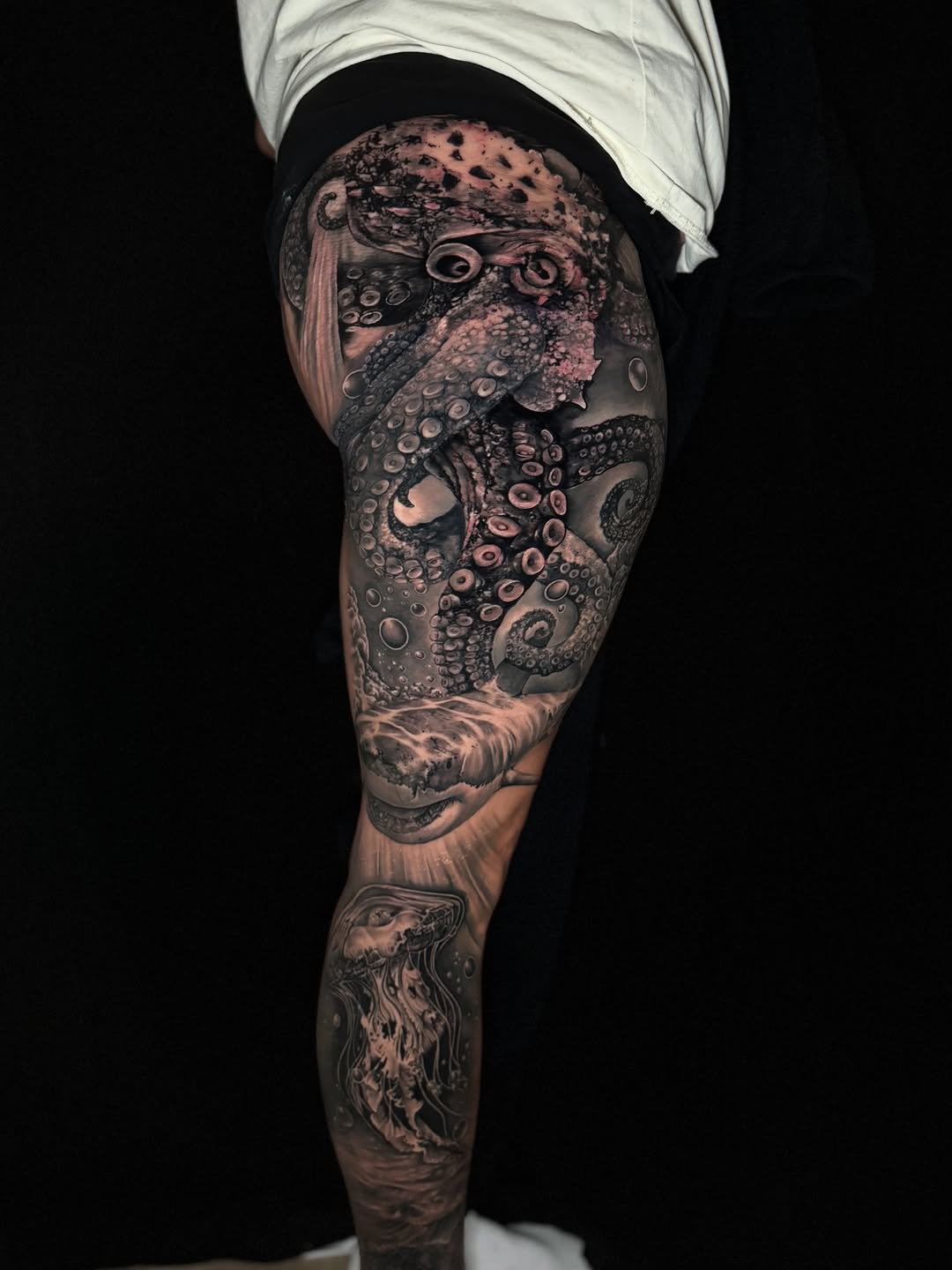 Octopus, shark, and jellyfish realism tattoo on the thigh by Georgianna Ink, Las Vegas, Nevada