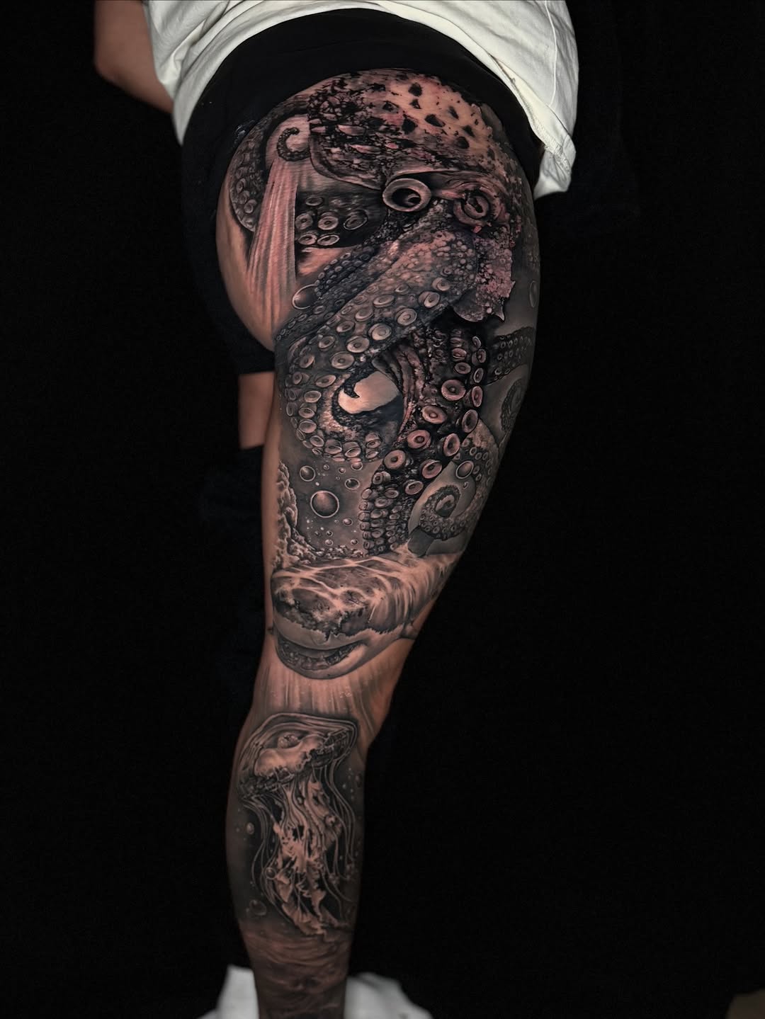 Octopus, shark, and jellyfish realism tattoo on the thigh by Georgianna Ink, Las Vegas, Nevada