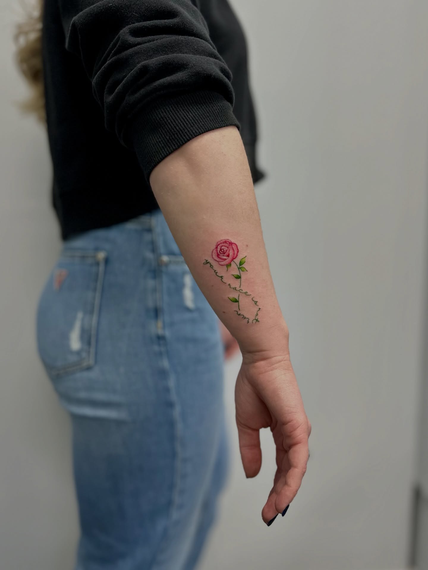 Rose fine line tattoo on the forearm by AJ