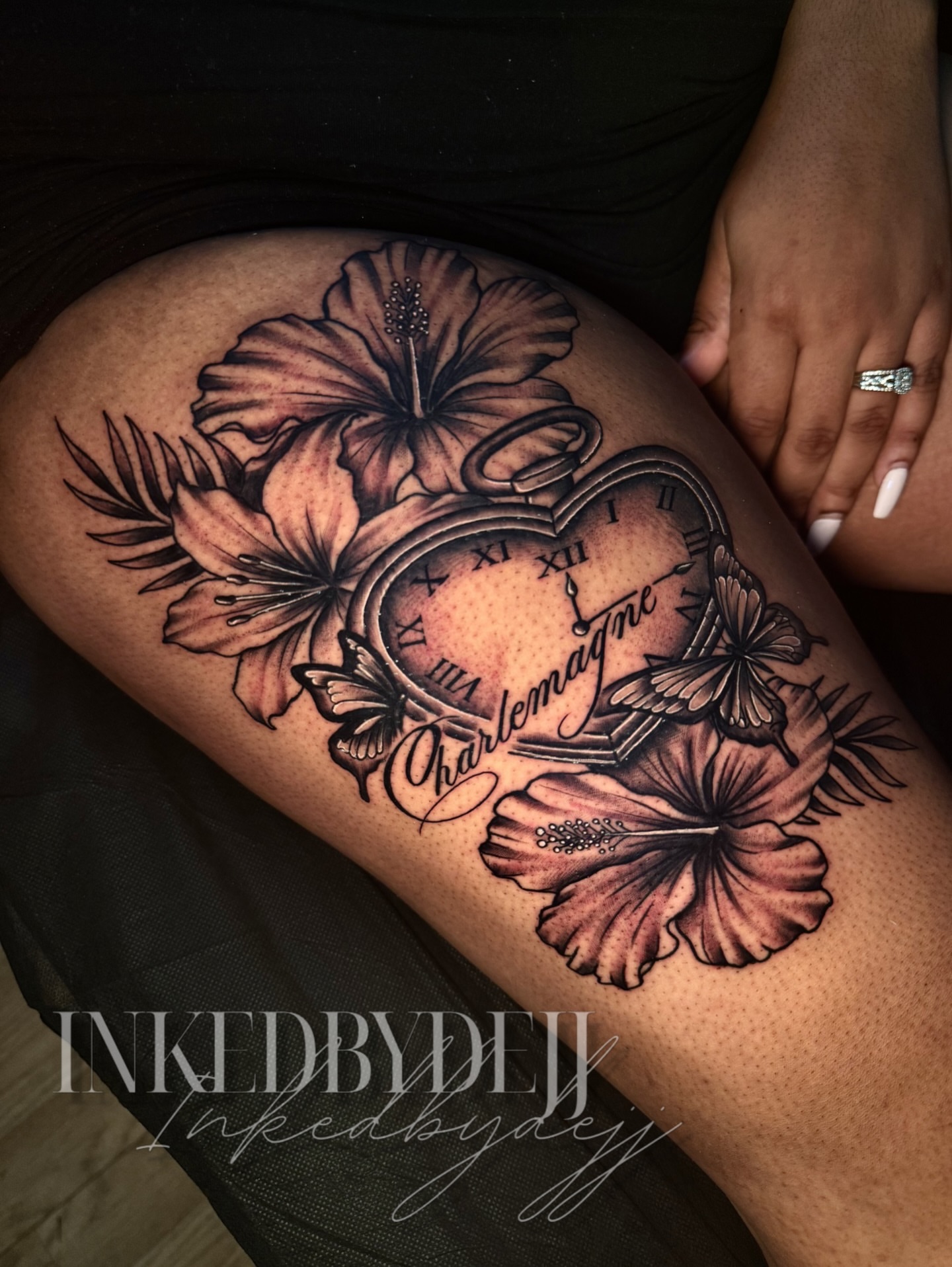 Heart clock with flowers realism tattoo on the thigh by Inkedbydejj