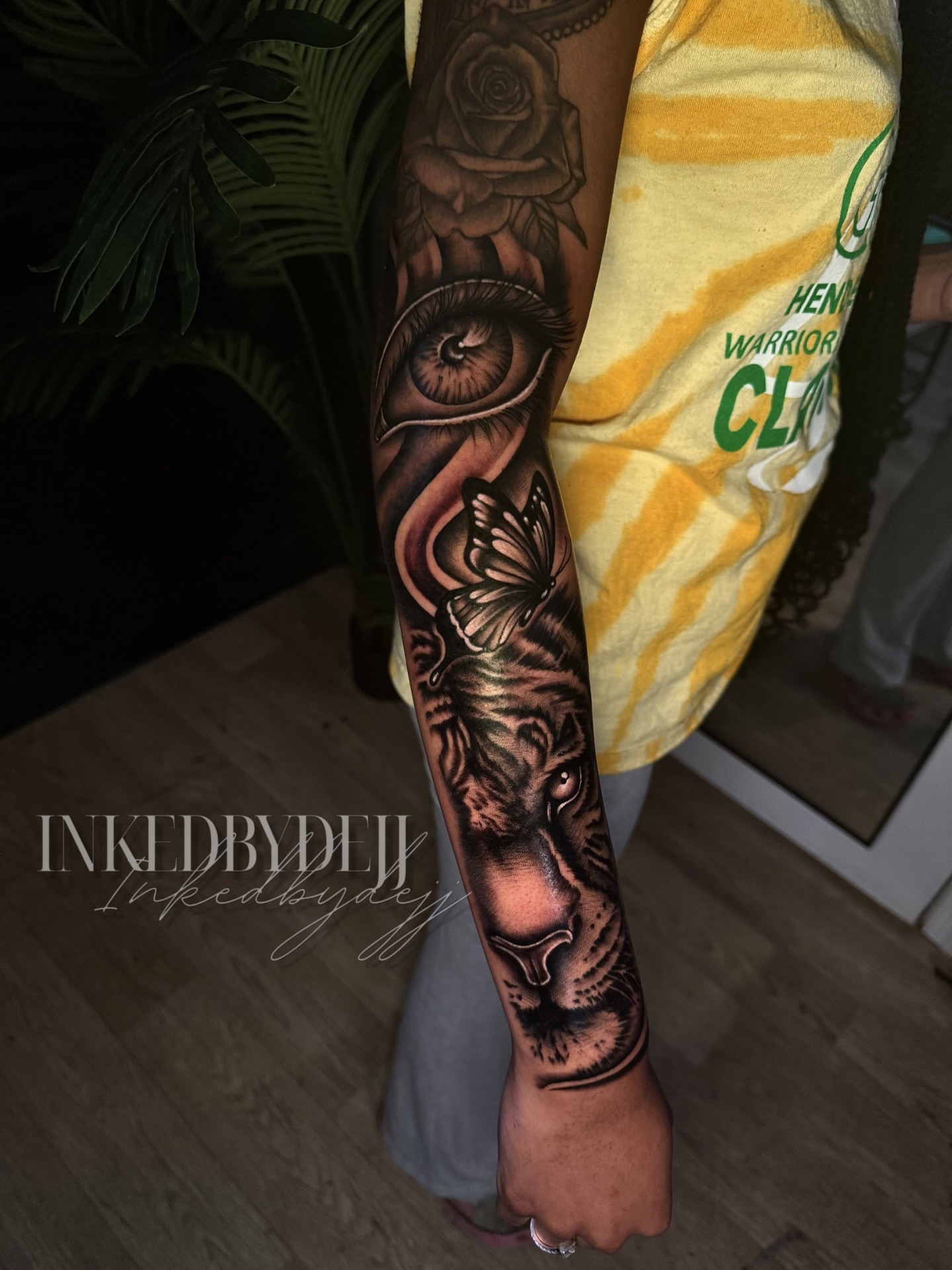 Lion and butterfly realism tattoo on the forearm by Inkedbydejj