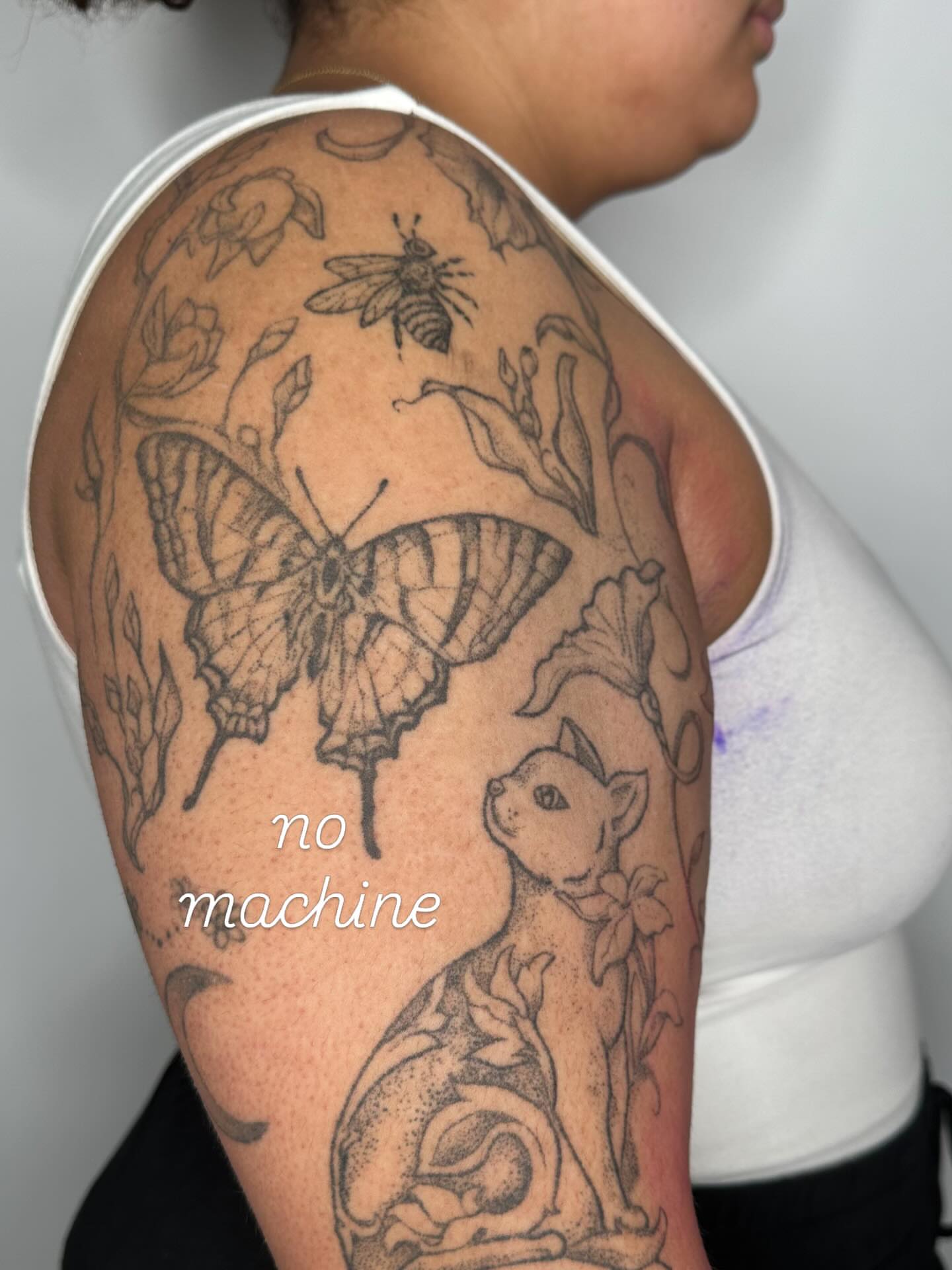 Butterfly, bee, cat, flowers dotwork tattoo on the shoulder by Sadie Spades Philly Tattoos