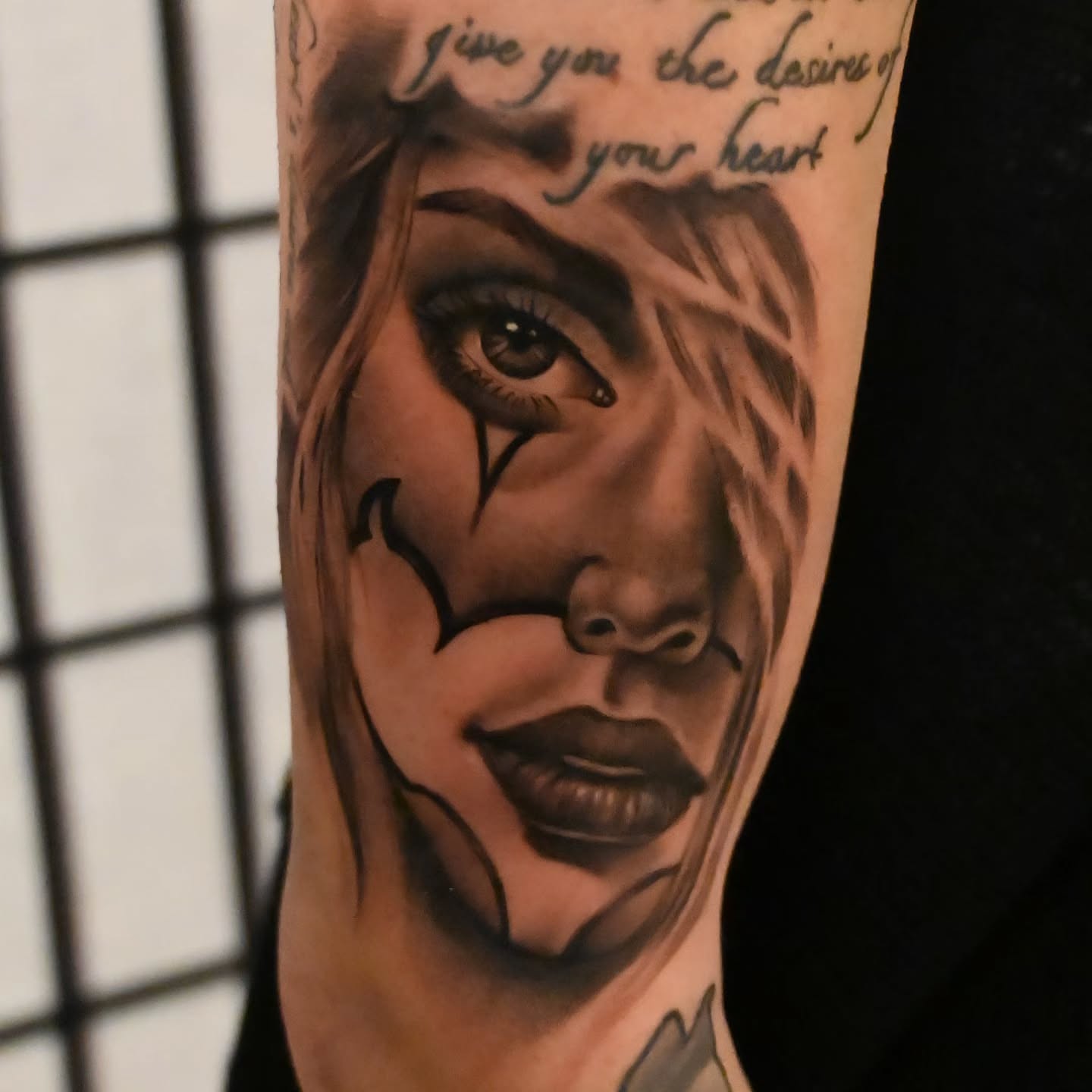 Woman's face realism tattoo on the forearm by Michael ORegan