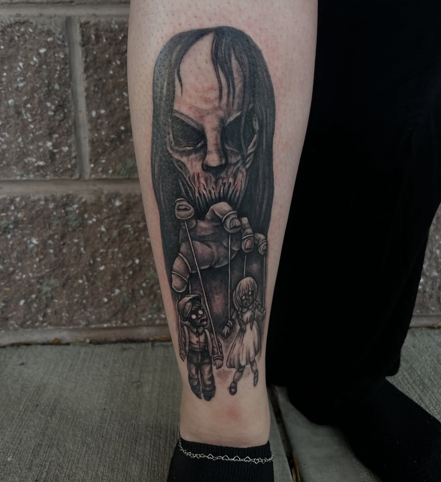 Tattoo by @ladymonsterfacetattoos — dark_realism, black_and_grey