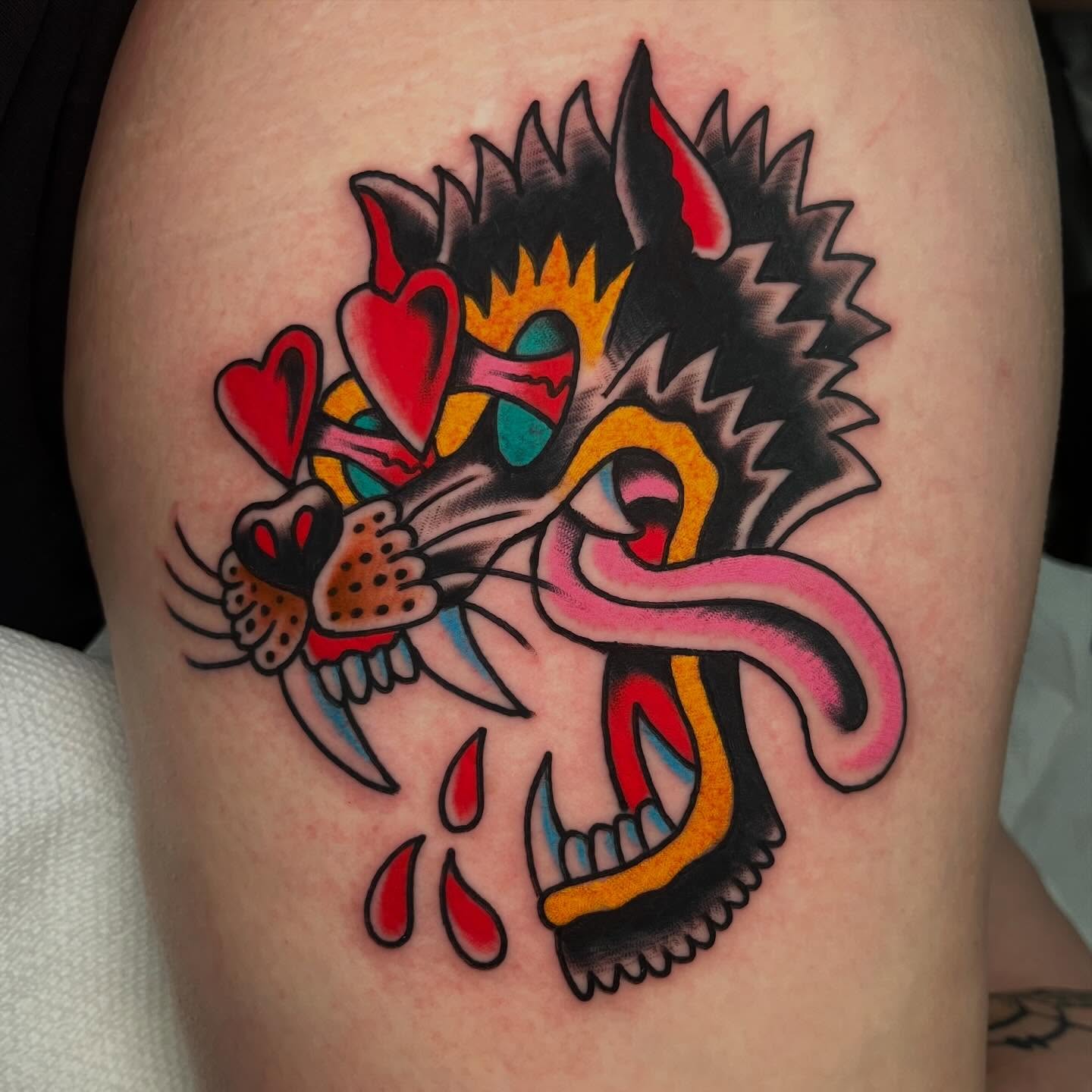 Panther with hearts American traditional tattoo on the thigh by Rizzo