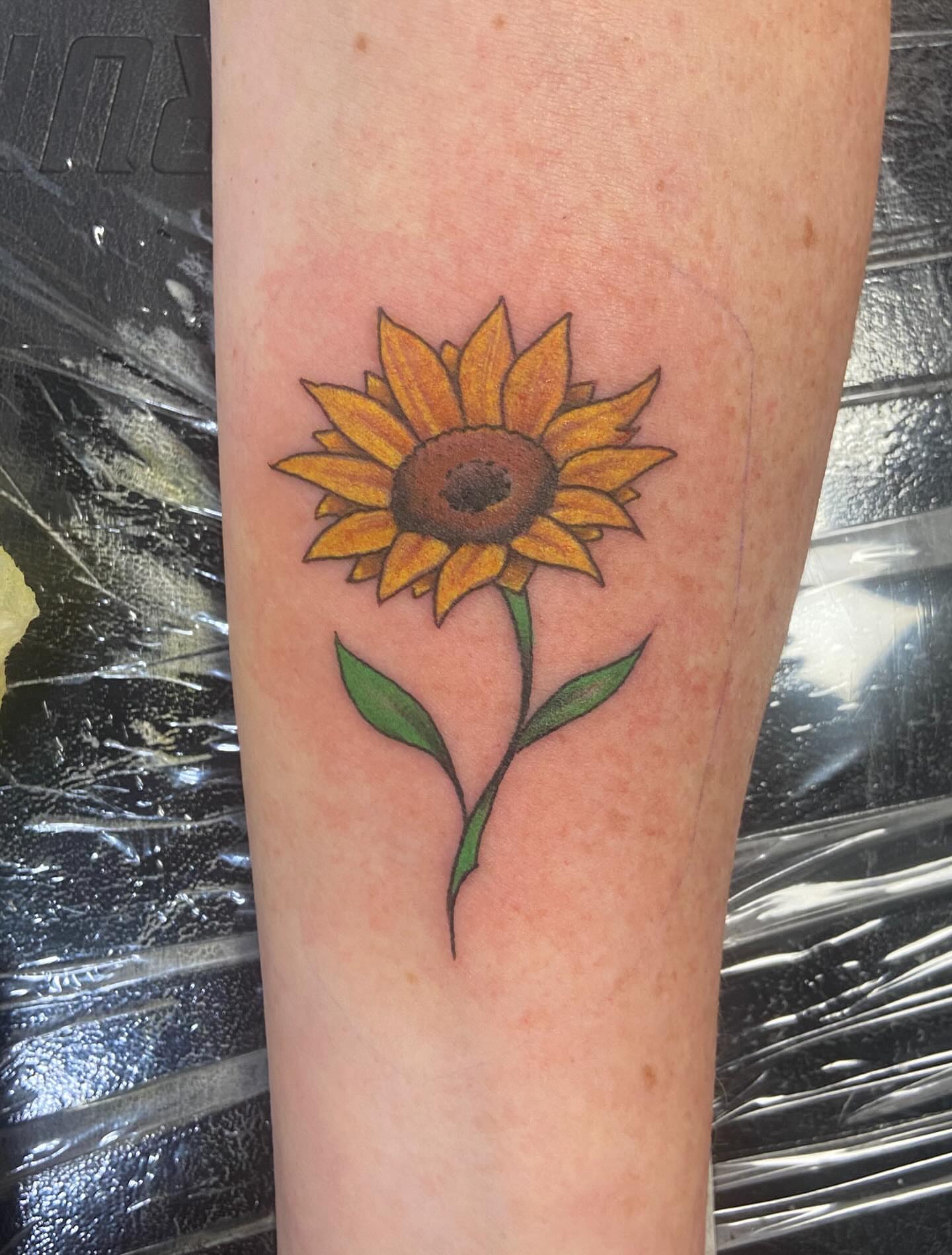 Sunflower realism tattoo on the forearm by Sam Hearnen, Lawrence, Kansas