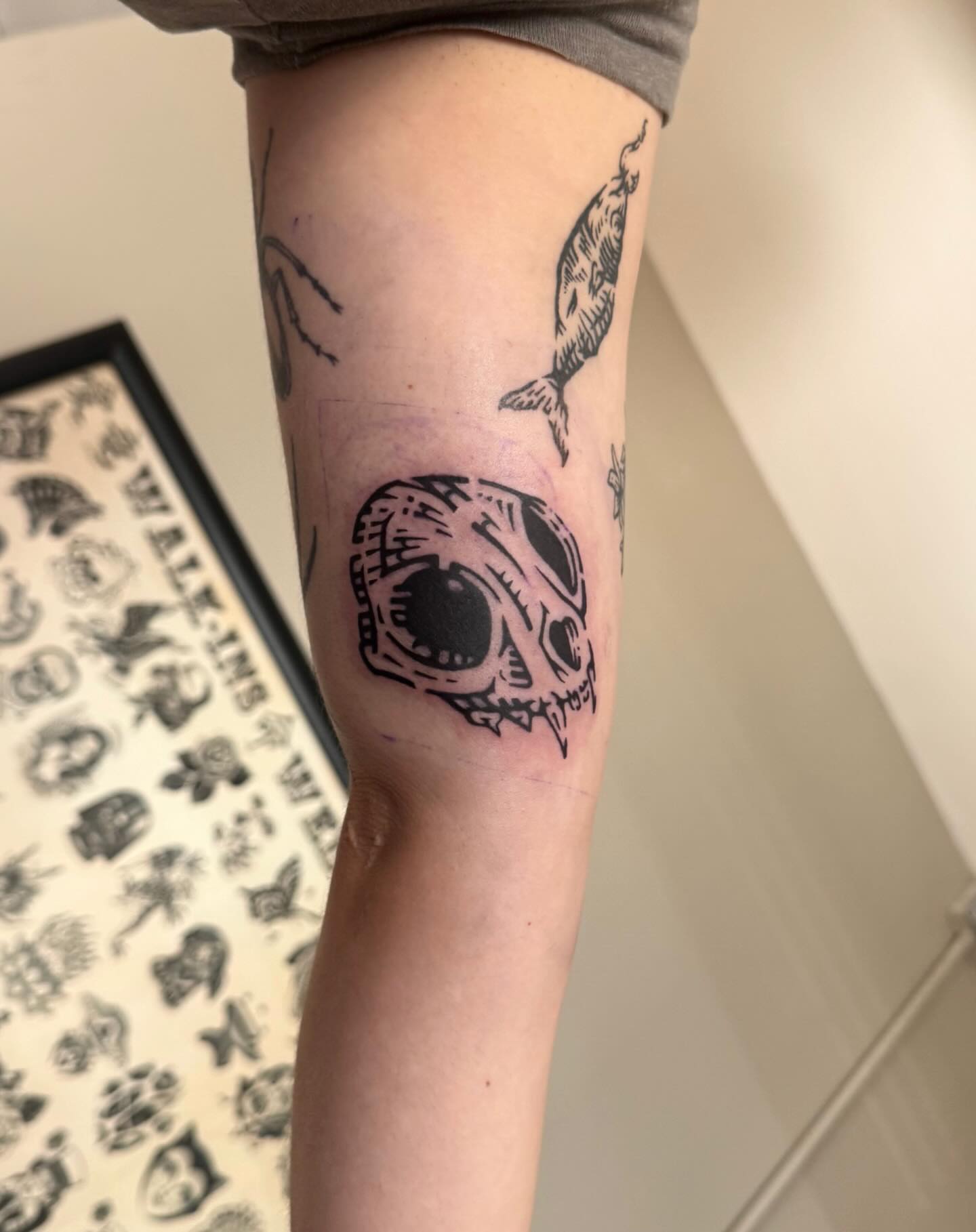 Skull black and grey tattoo on the forearm by M