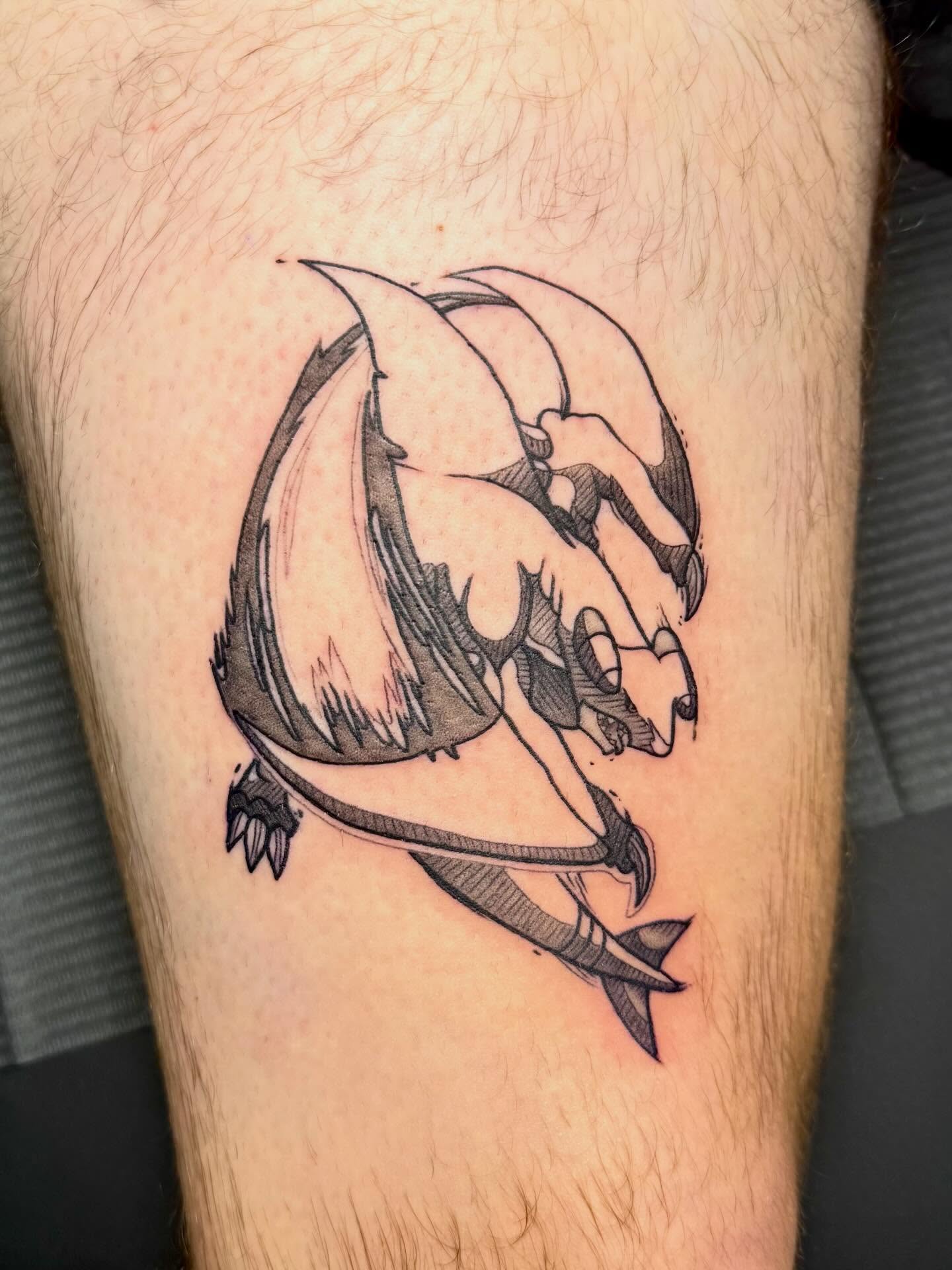 Dragon black and grey tattoo on the thigh by Taylor Kay 🌿