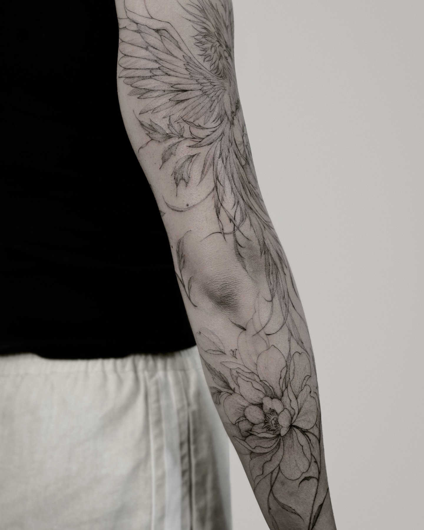 Floral wings realism tattoo on the forearm by Yeonji
