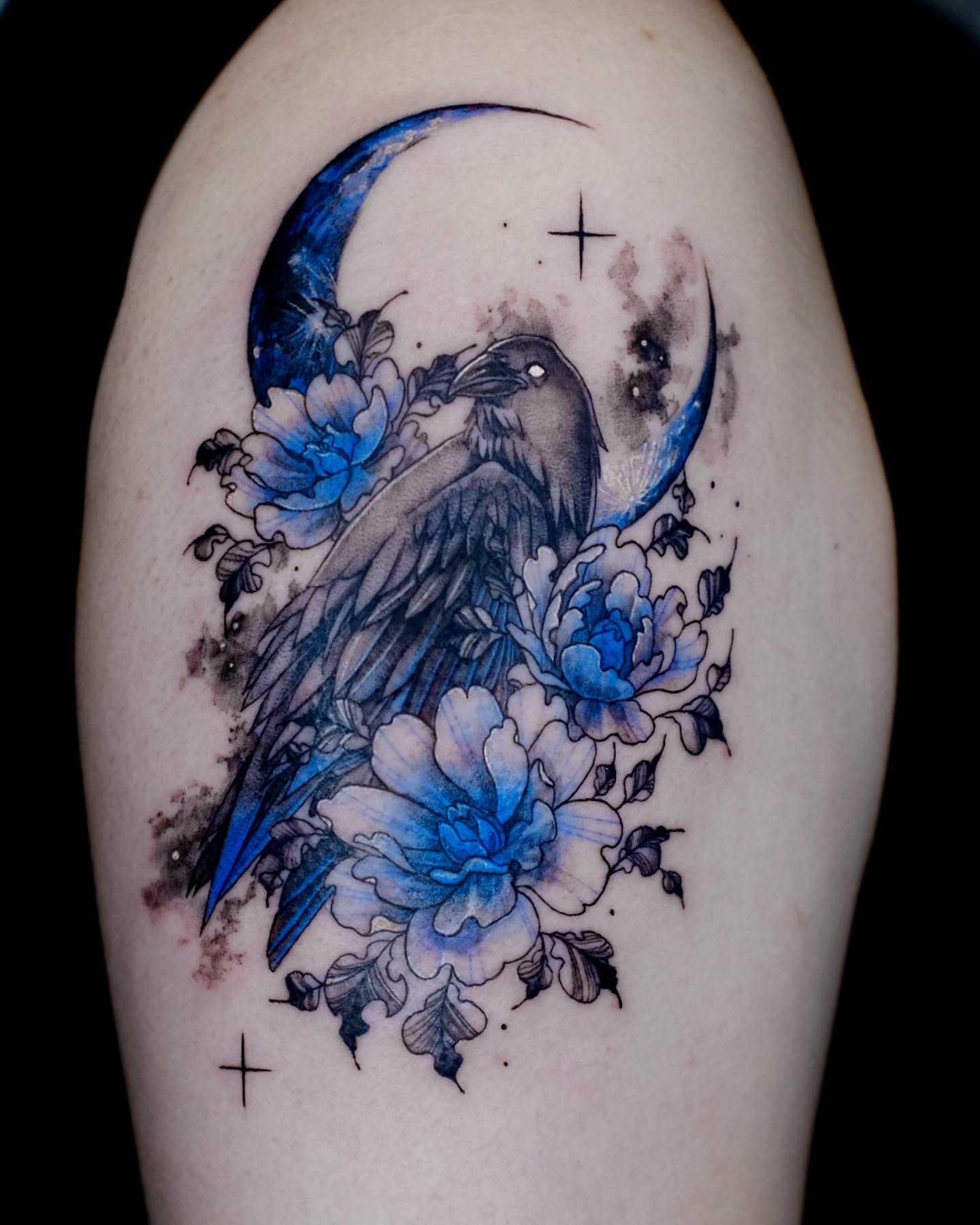 Raven and flowers watercolor tattoo on the shoulder by danha_seoul tattooist