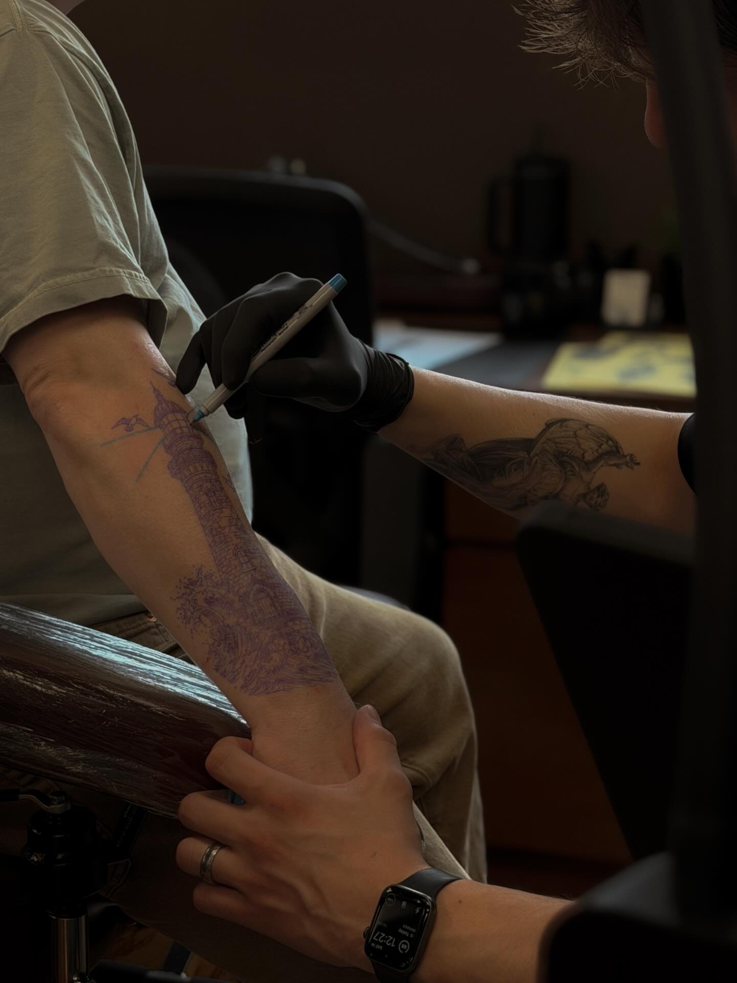 Tower and landscape black and grey tattoo on the forearm by Arthur Kossoski