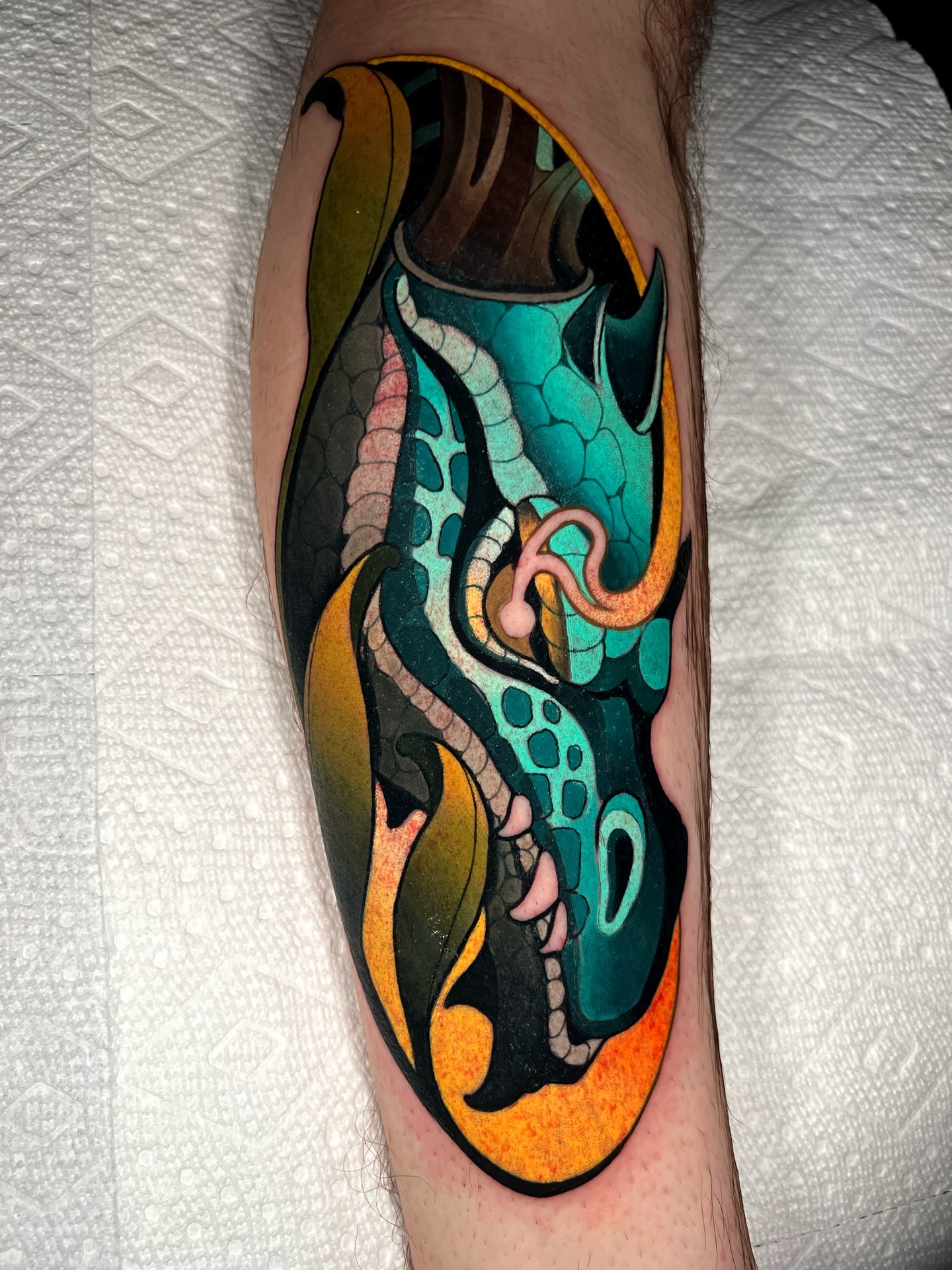 Serpent new school tattoo on the forearm by Skyler Miller