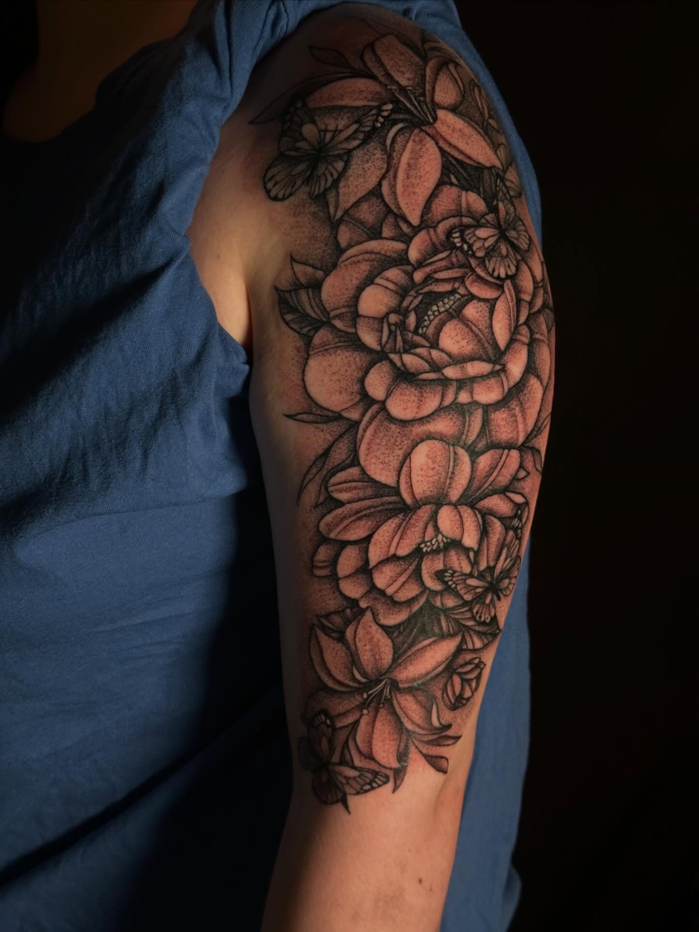 Floral bouquet black and grey tattoo on the forearm by Elizabeth Tabler