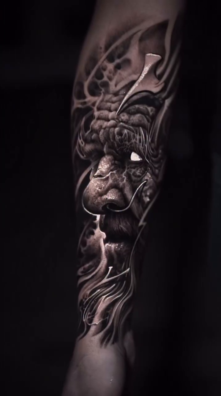 Demonic face with abstract elements Japanese tattoo on the forearm by Victor Portugal Tattoo