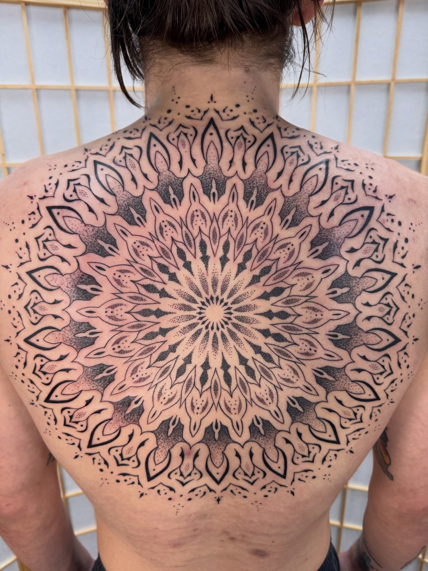Mandala dotwork tattoo on the back by Ian Spencer
