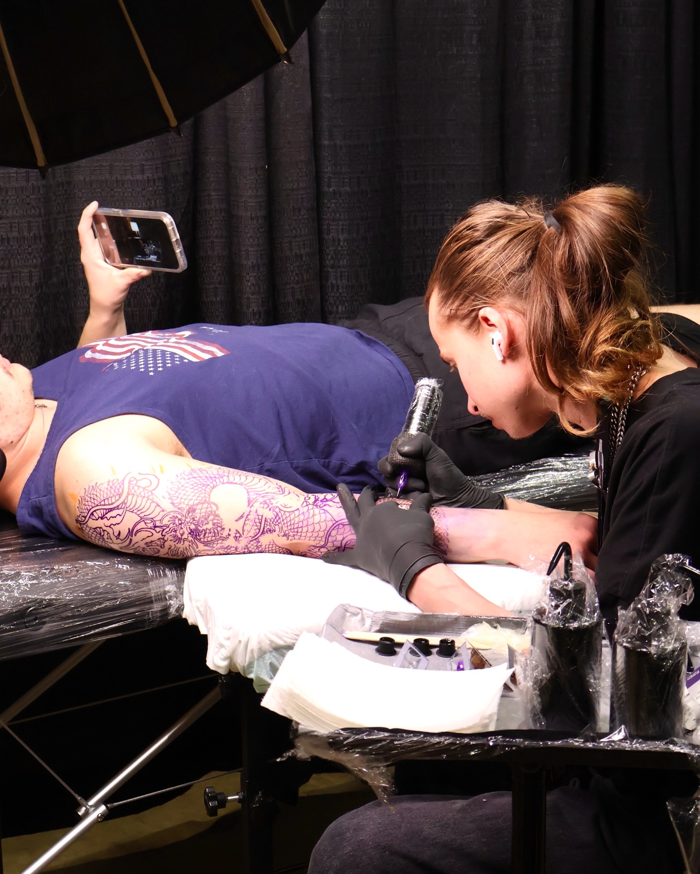 Floral design American traditional tattoo on the upper arm by Ingrid Rojas