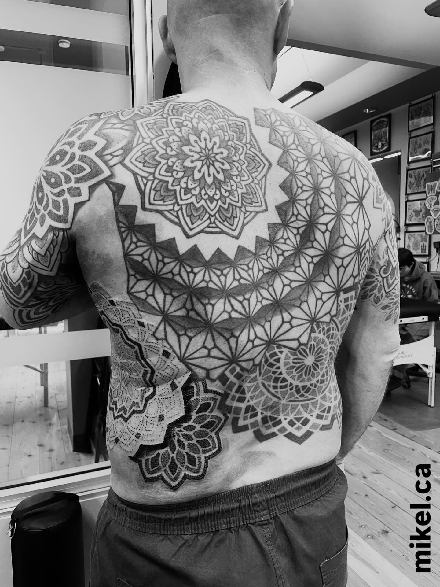 Geometric mandala geometric tattoo on the back by mikel_tattoosangha