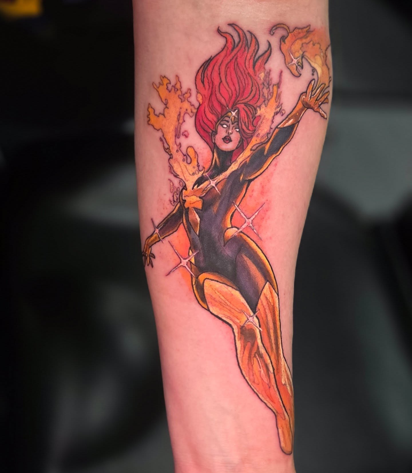 Phoenix new school tattoo on the forearm by Trinity Renee