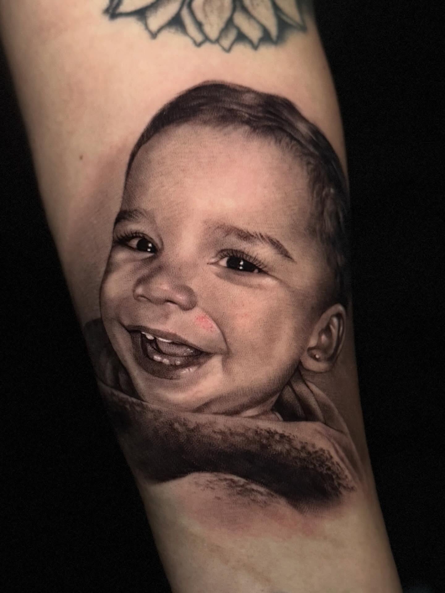Child's face realism tattoo on the forearm by Sena Sim 🇰🇭, Worcester, Massachusetts
