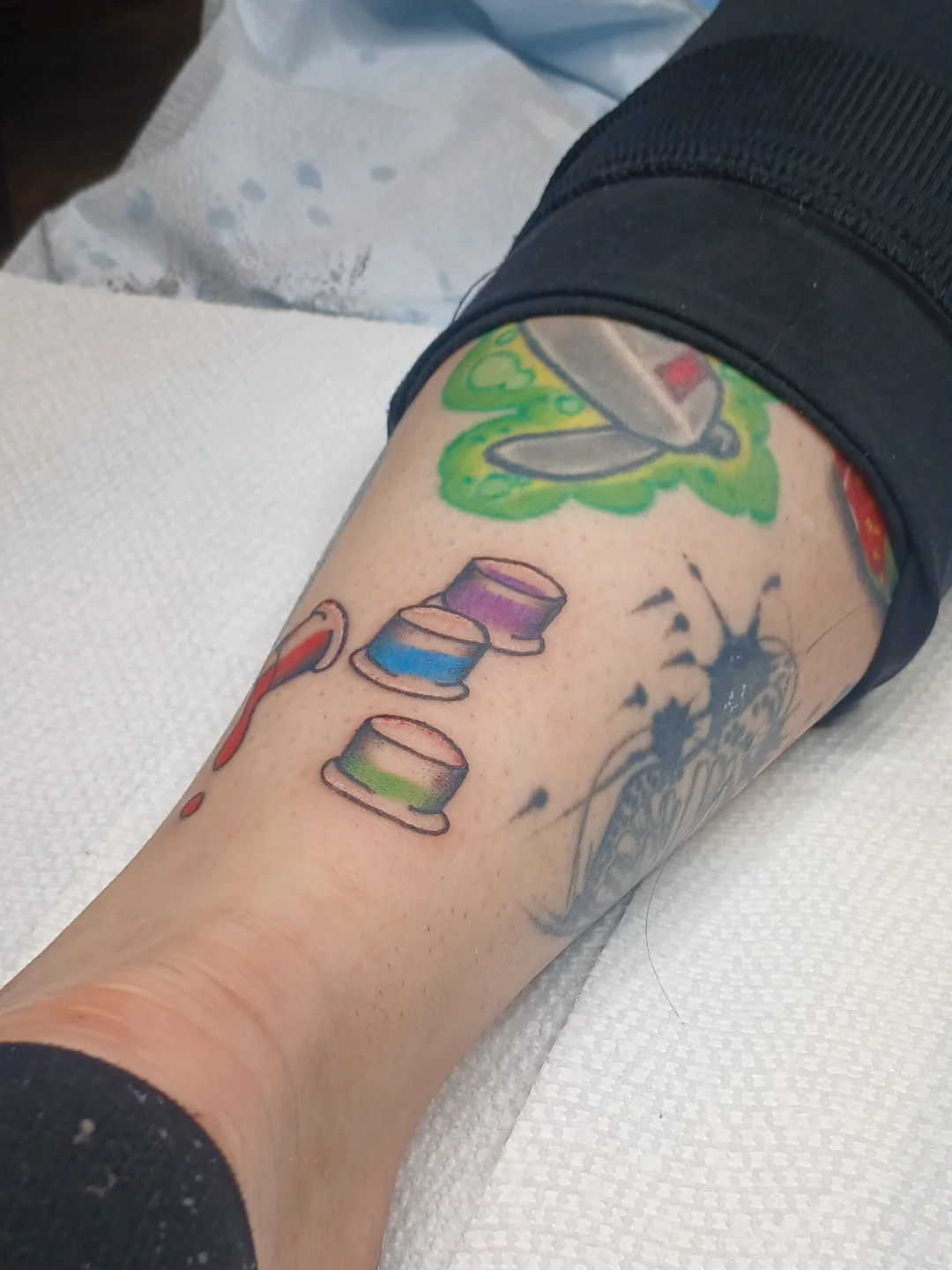 Tea cups and kettle new school tattoo on the forearm by Amber Tattoos