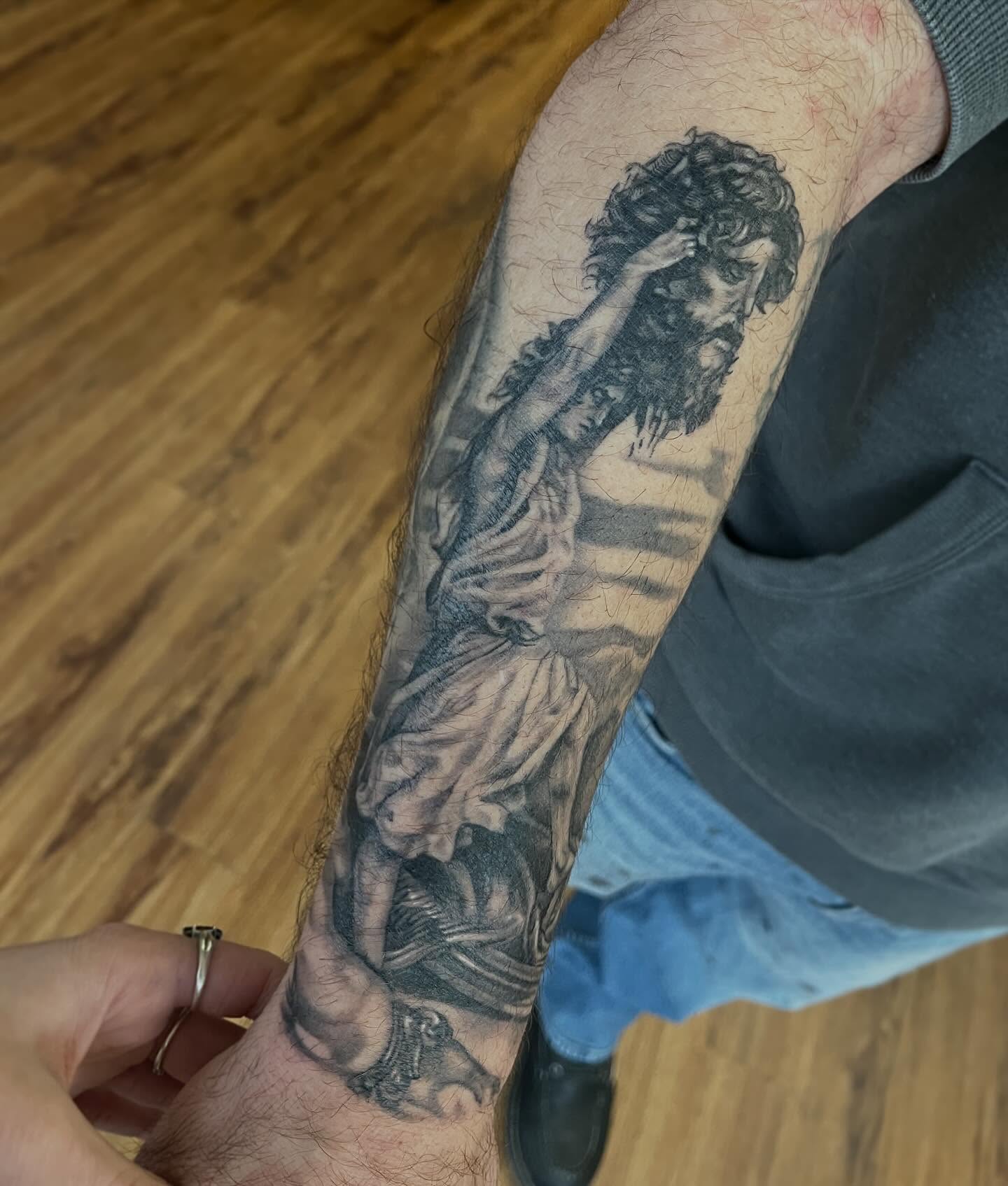 Statue black and grey tattoo on the forearm by Taylor Santavicca