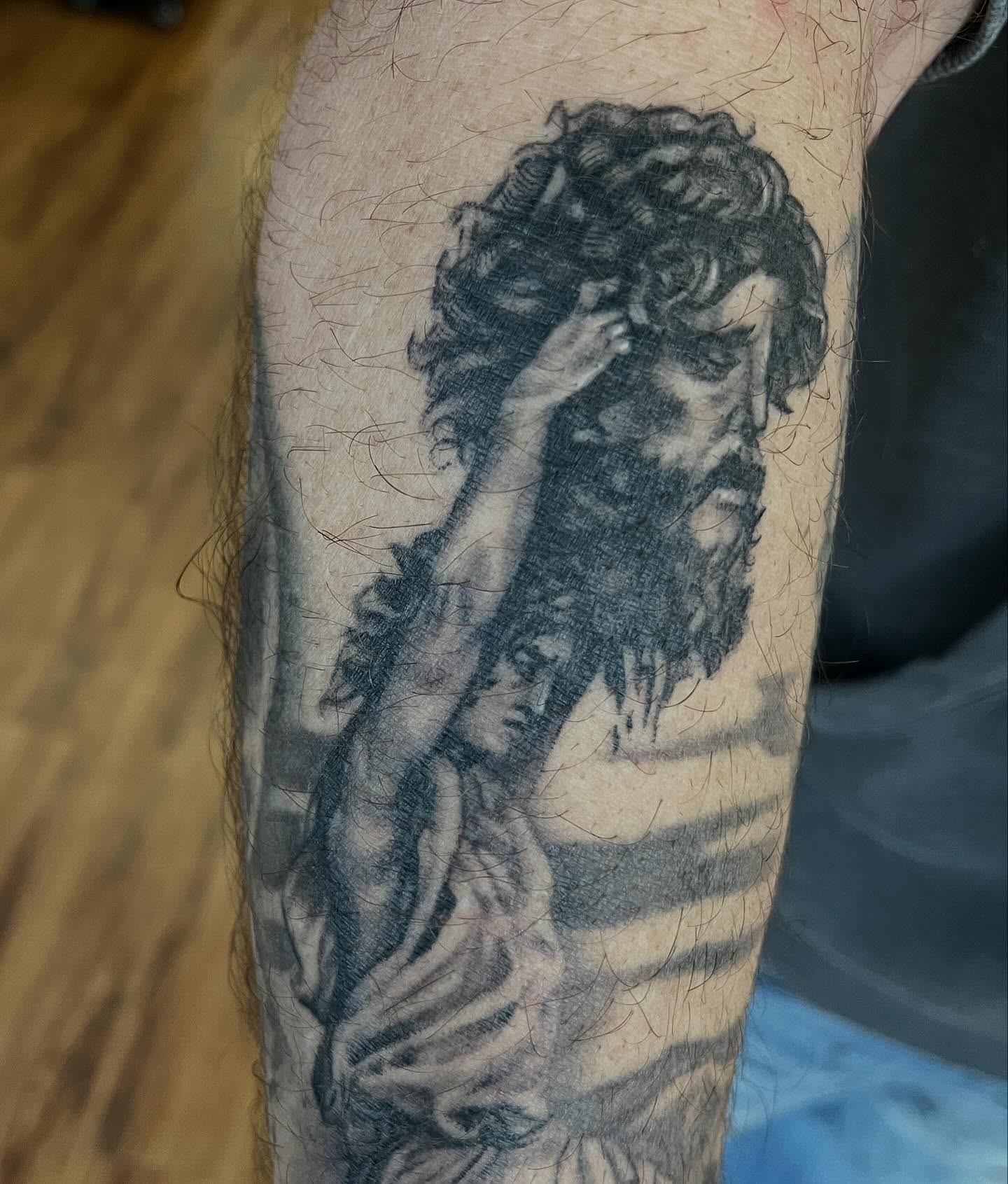 Man with beard black and grey tattoo on the forearm by Taylor Santavicca