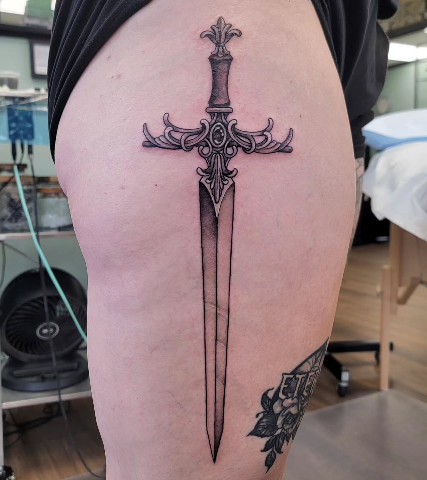 Sword black and grey tattoo on the thigh by Chantel Chan, Portland, Oregon