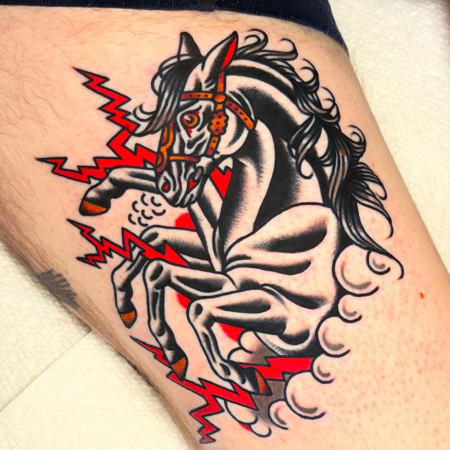 Galloping horse American traditional tattoo on the thigh by Zoe Margot