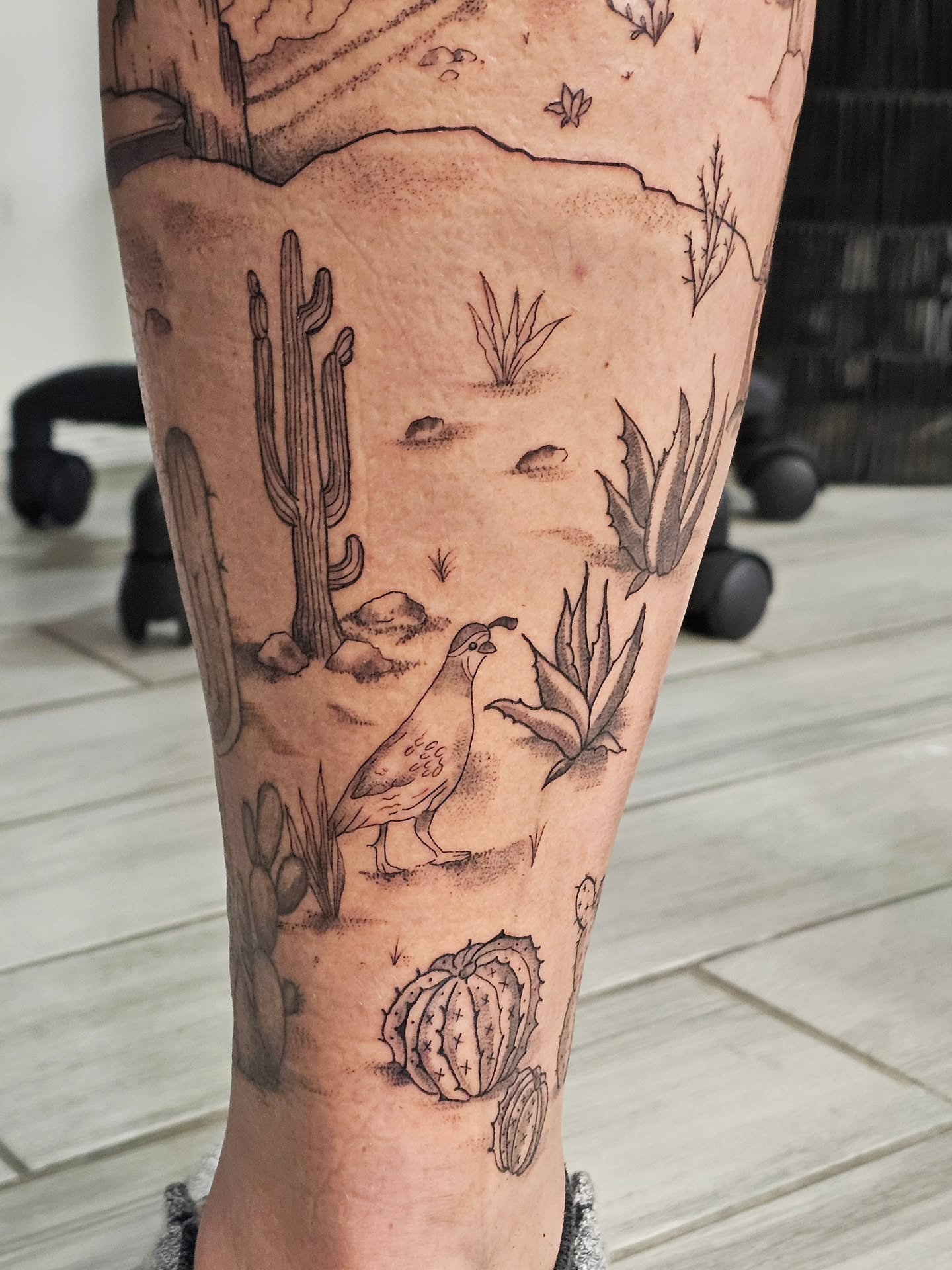Desert landscape realism tattoo on the leg by Casey Jo