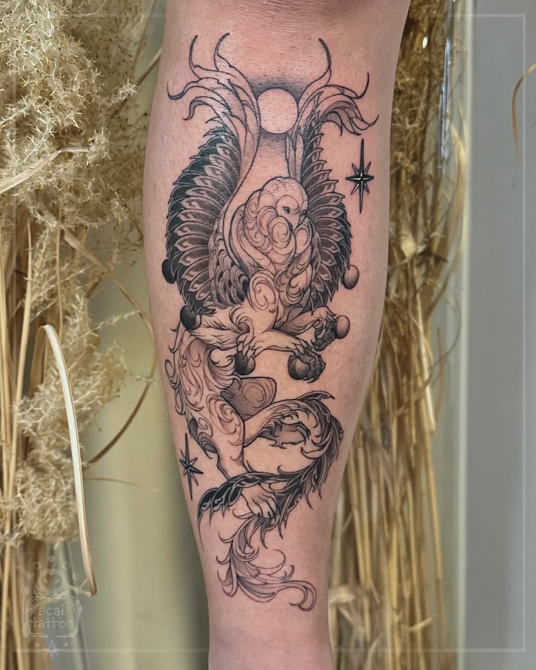 Winged creature with fruit fine line tattoo on the forearm by scaitattoo