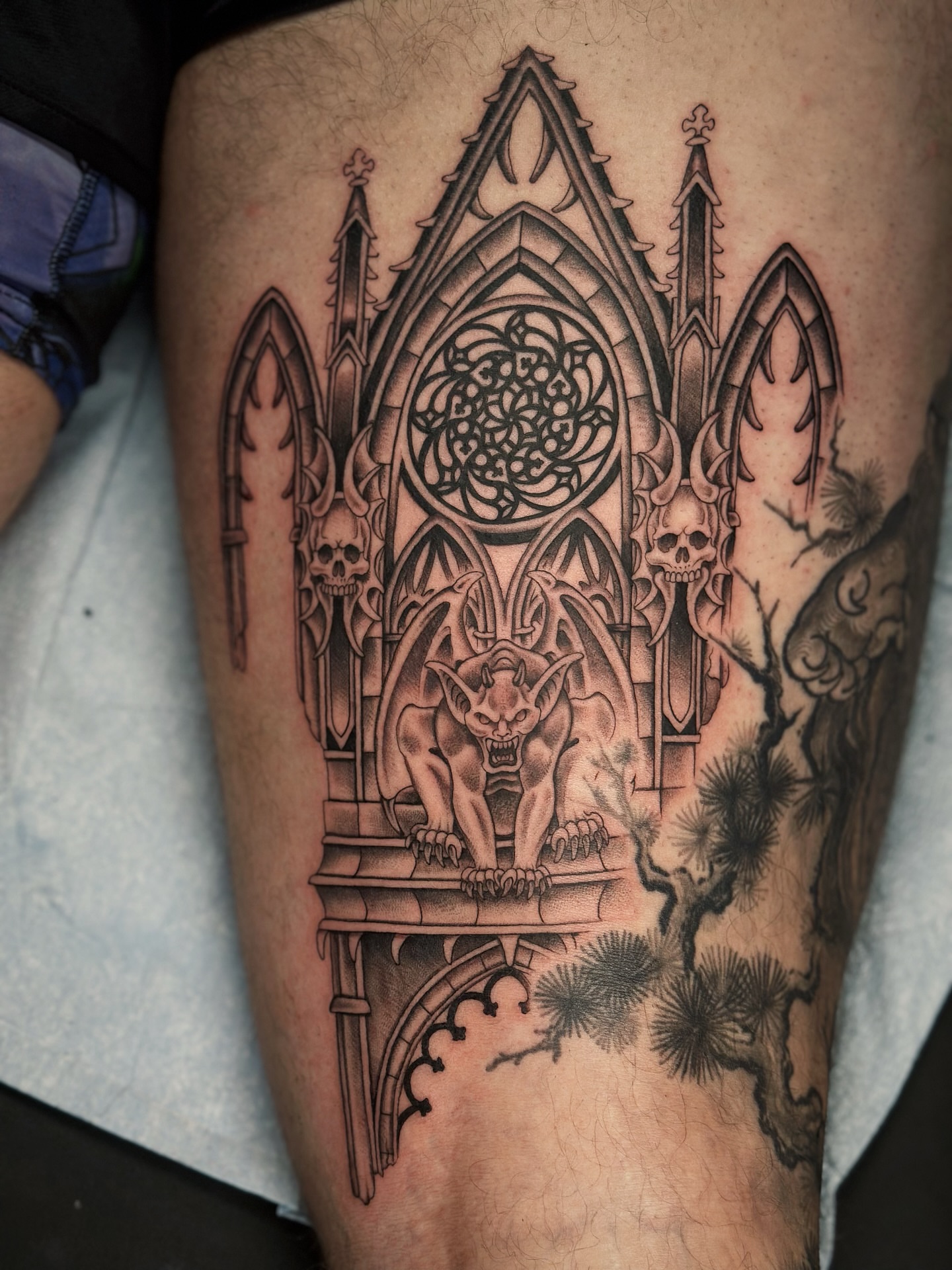 Gothic cathedral dark realism tattoo on the thigh by Lauryn Jenesis