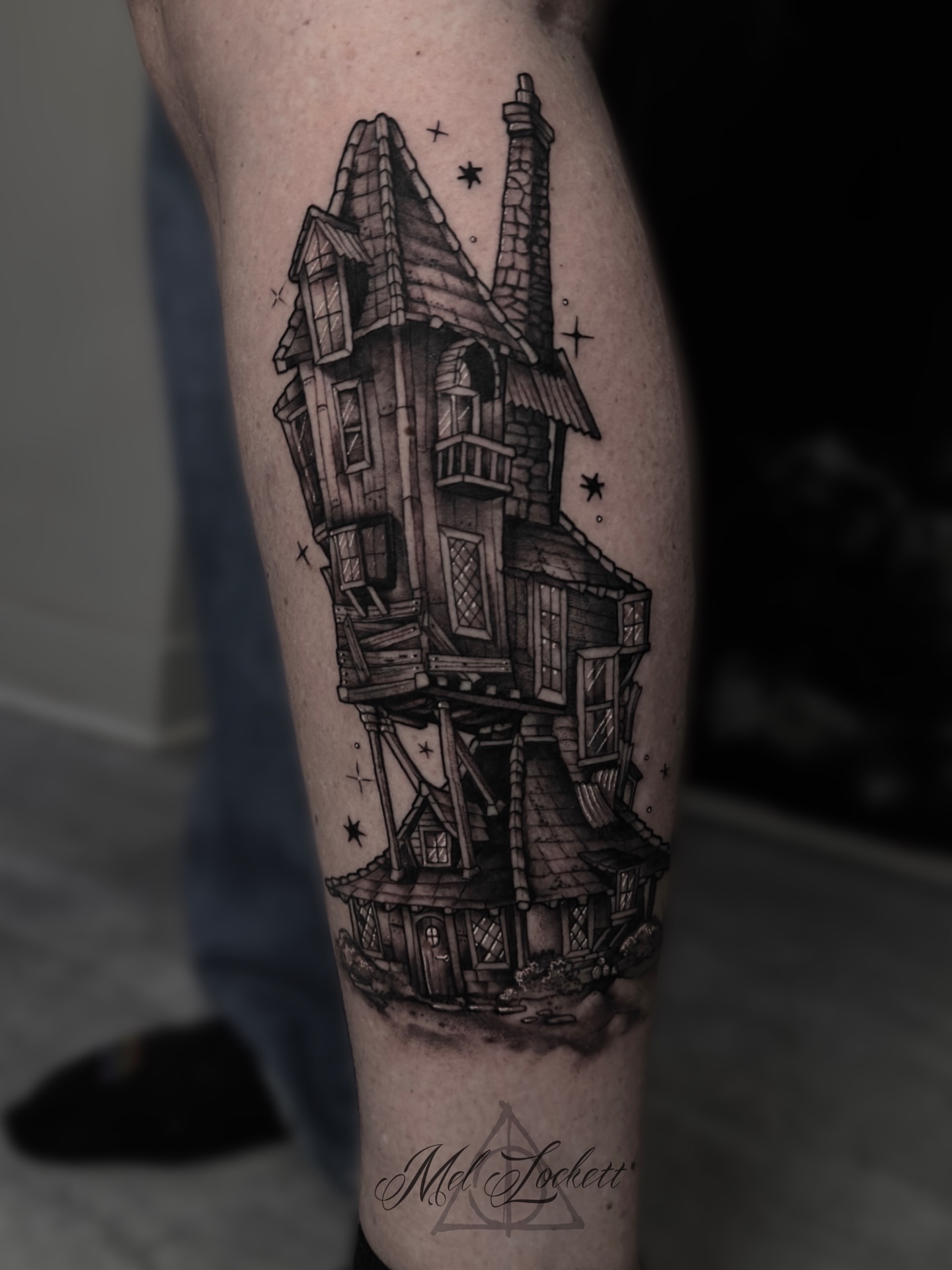 Haunted house realism tattoo on the forearm by Mel K Lockett - Nashville Tattoo Artist