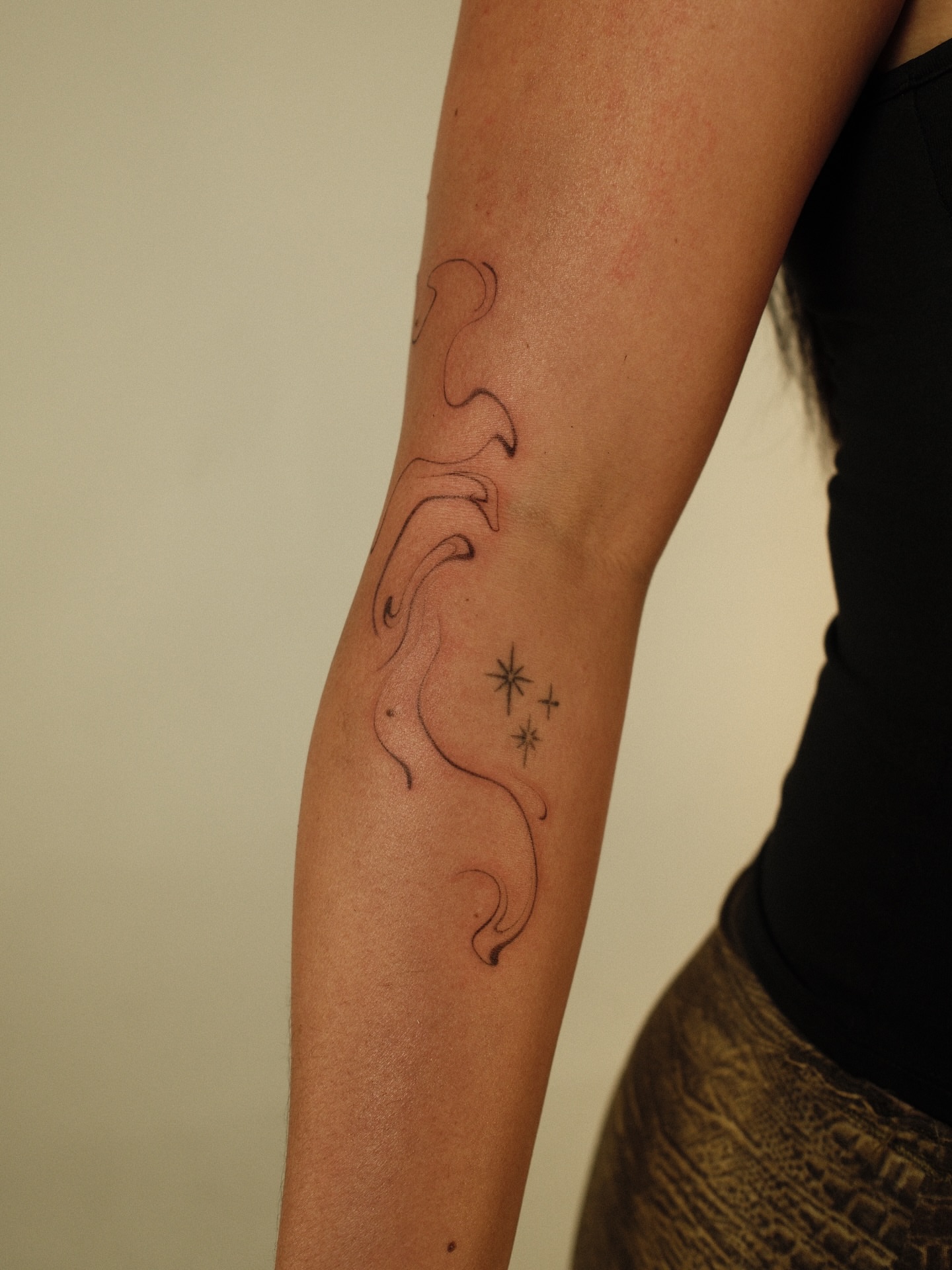 Waves and stars black and grey tattoo on the forearm by v?