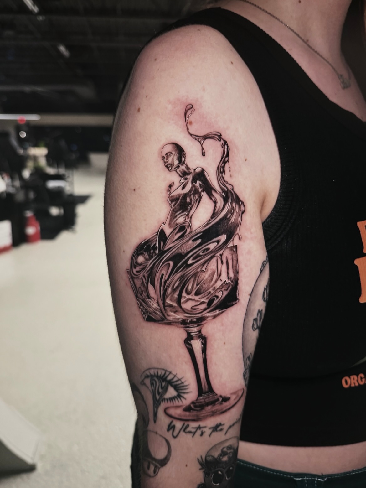 Melting figure realism tattoo on the forearm by Kelsey Zussman
