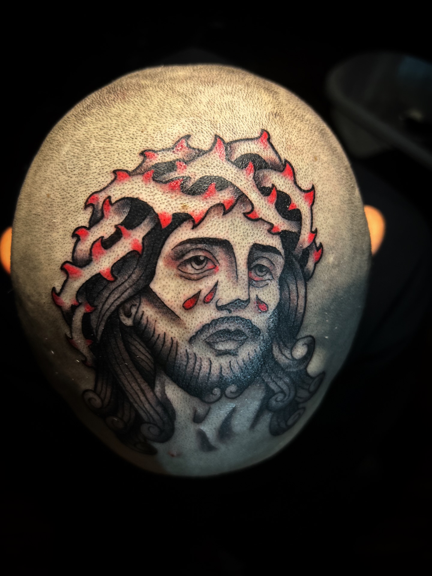 Jesus Christ American traditional tattoo on the head by Eli Flores