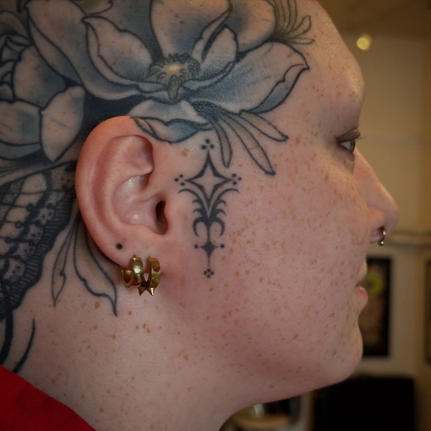 Flower black and grey tattoo on the head by Bree Lin