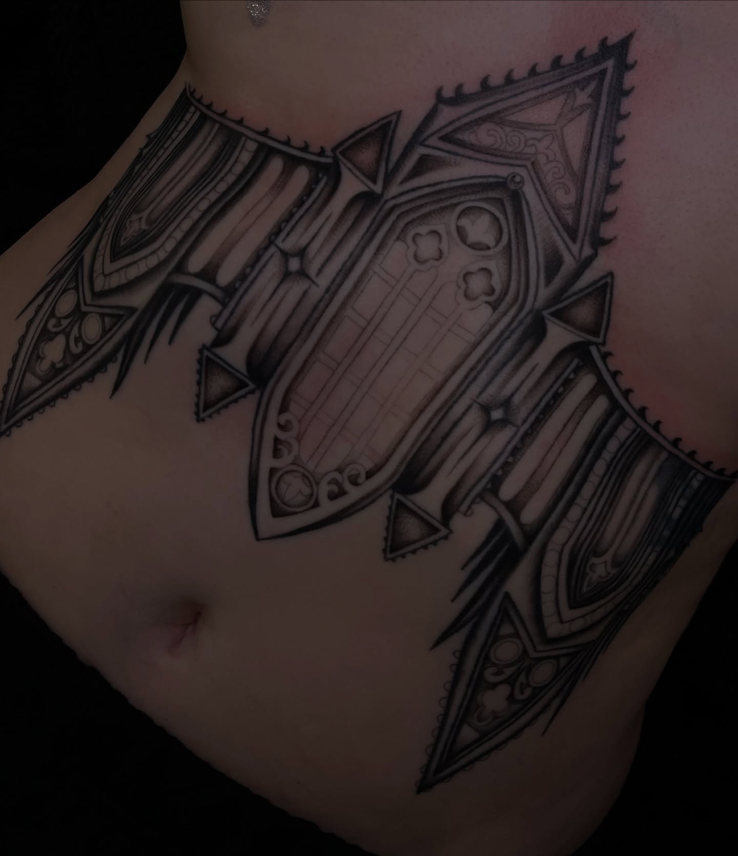 Gothic cathedral geometric tattoo on the torso by Kyla Jae