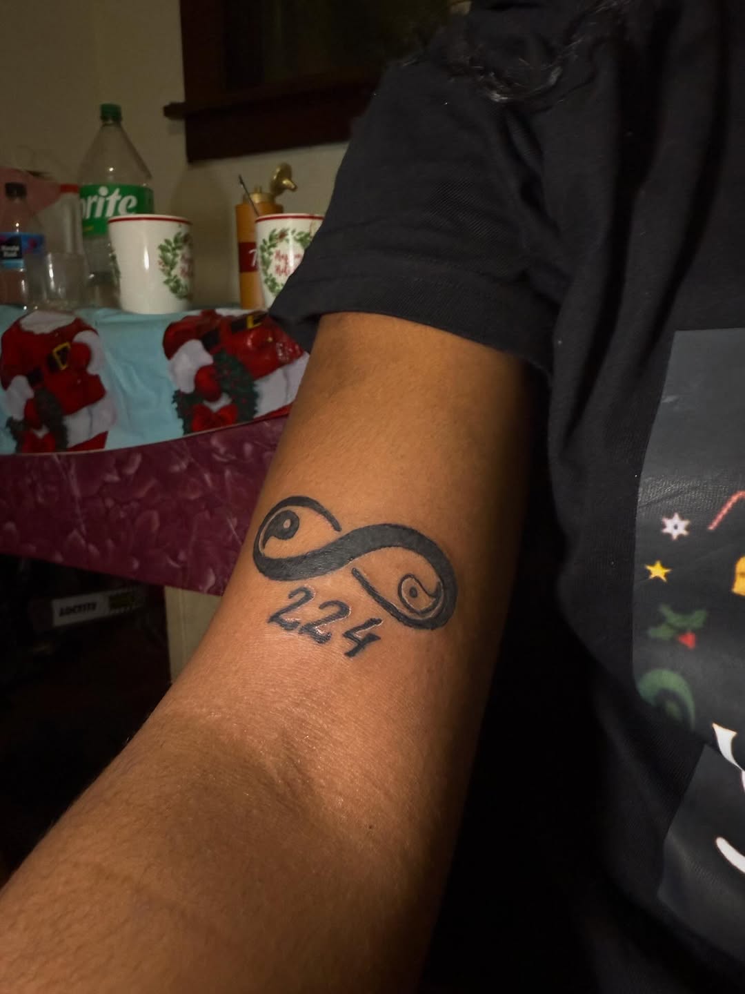 Infinity symbol with numbers tattoo on the forearm by Eunoia Tattoos