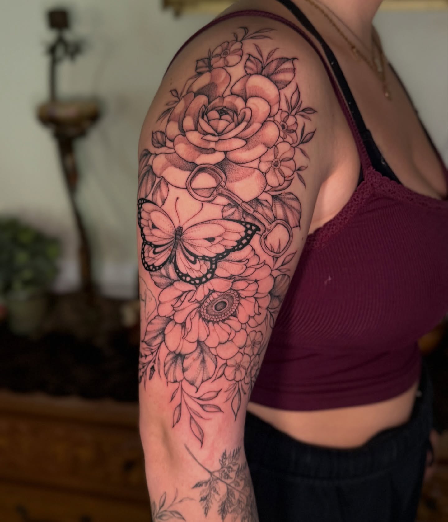 Floral bouquet realism tattoo on the upper arm by Chiah