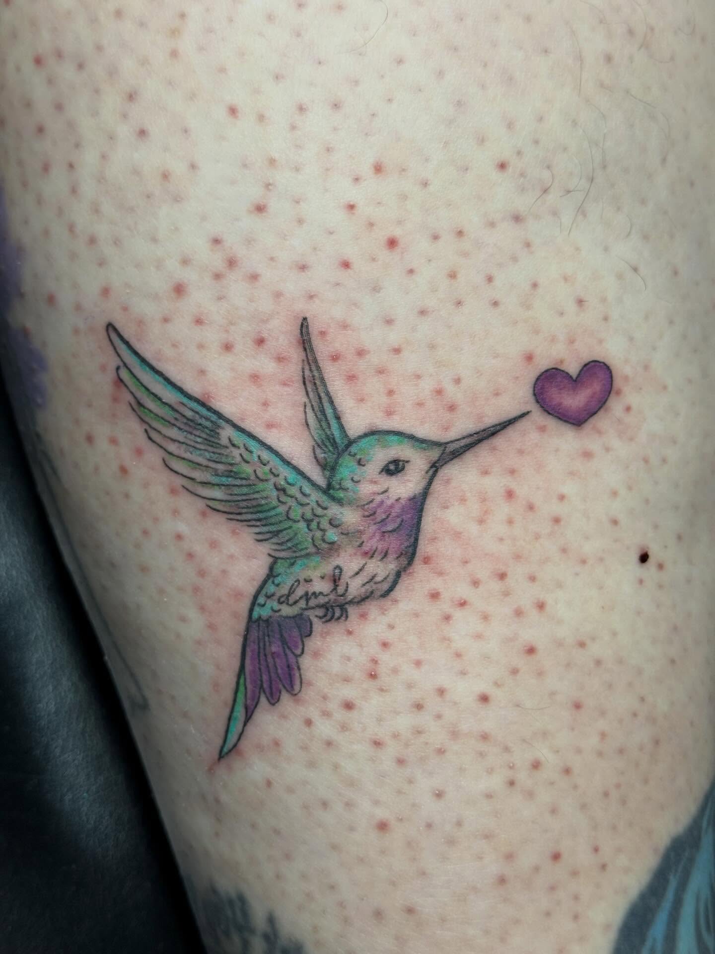 Hummingbird and heart dotwork tattoo on the thigh by Camryn Justice