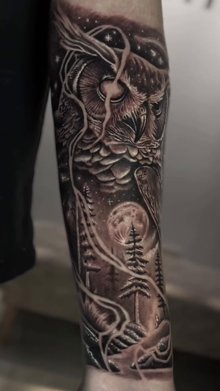 Owl with moon and trees realism tattoo on the forearm by Clayderman