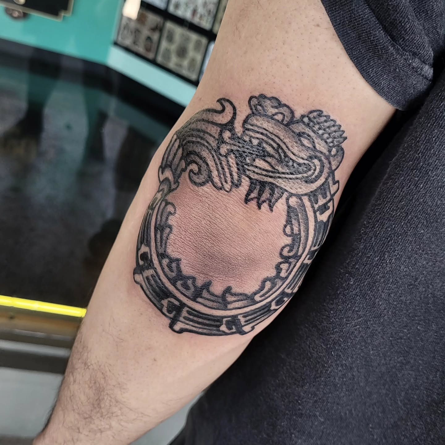 Dragon black and grey tattoo on the forearm by S. Madrid