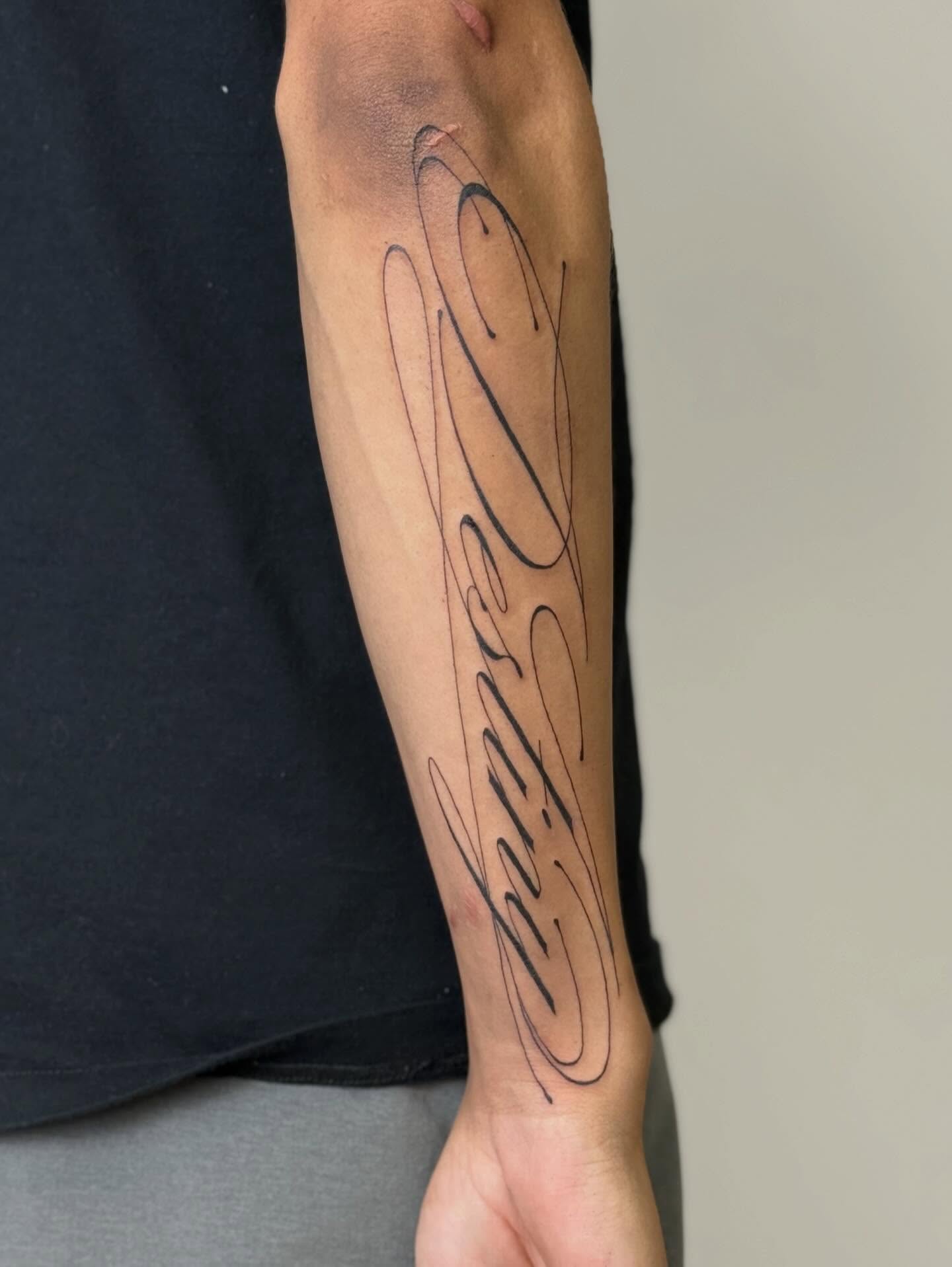 Script lettering lettering script tattoo on the forearm by Nevaeh tattoo artist