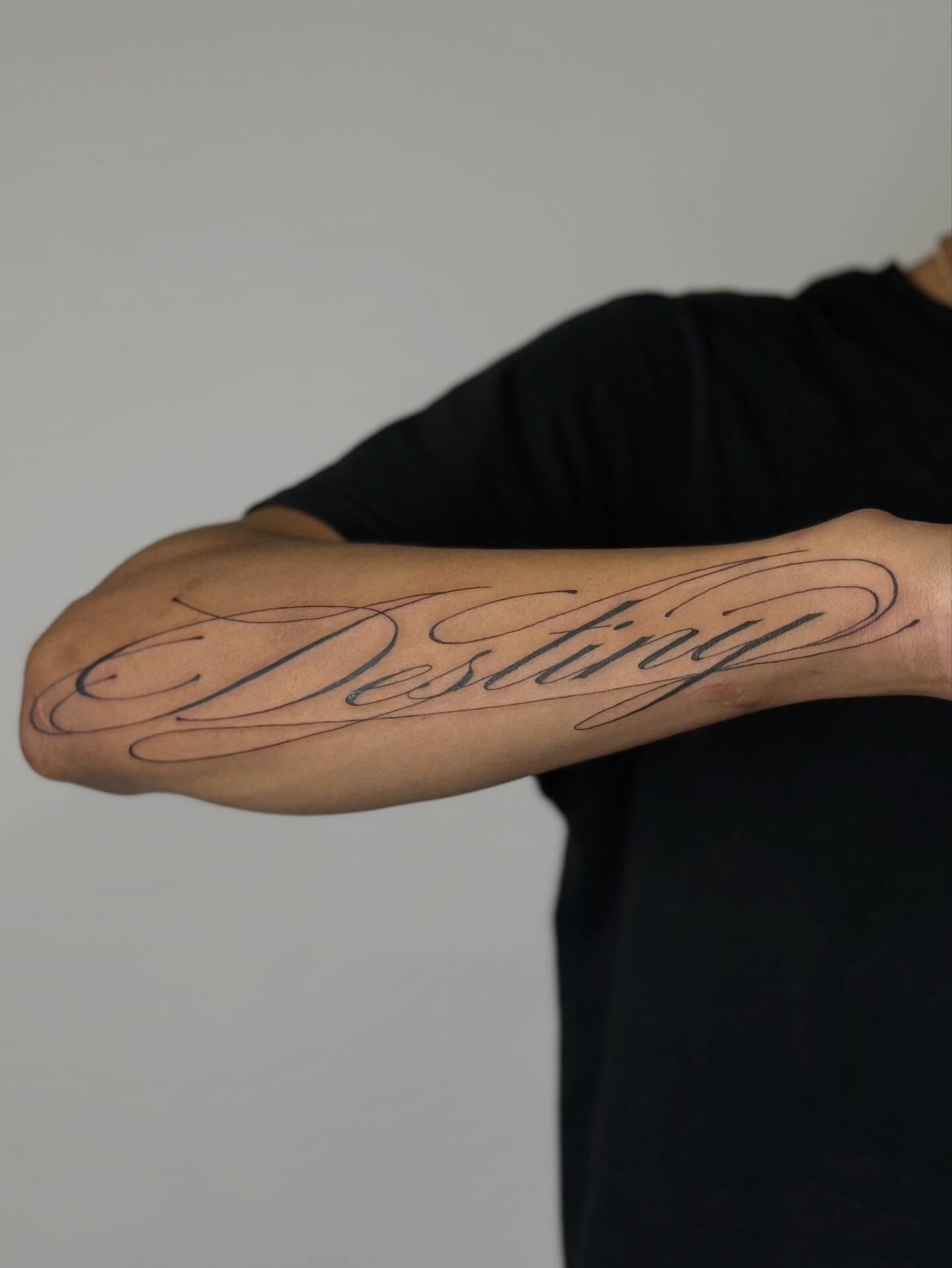 Script lettering lettering script tattoo on the forearm by Nevaeh tattoo artist