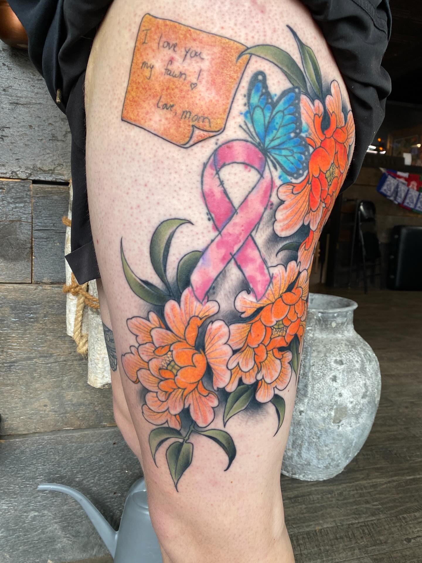 Breast cancer awareness ribbon new school tattoo on the thigh by Kyle Kozek, Columbus, Ohio