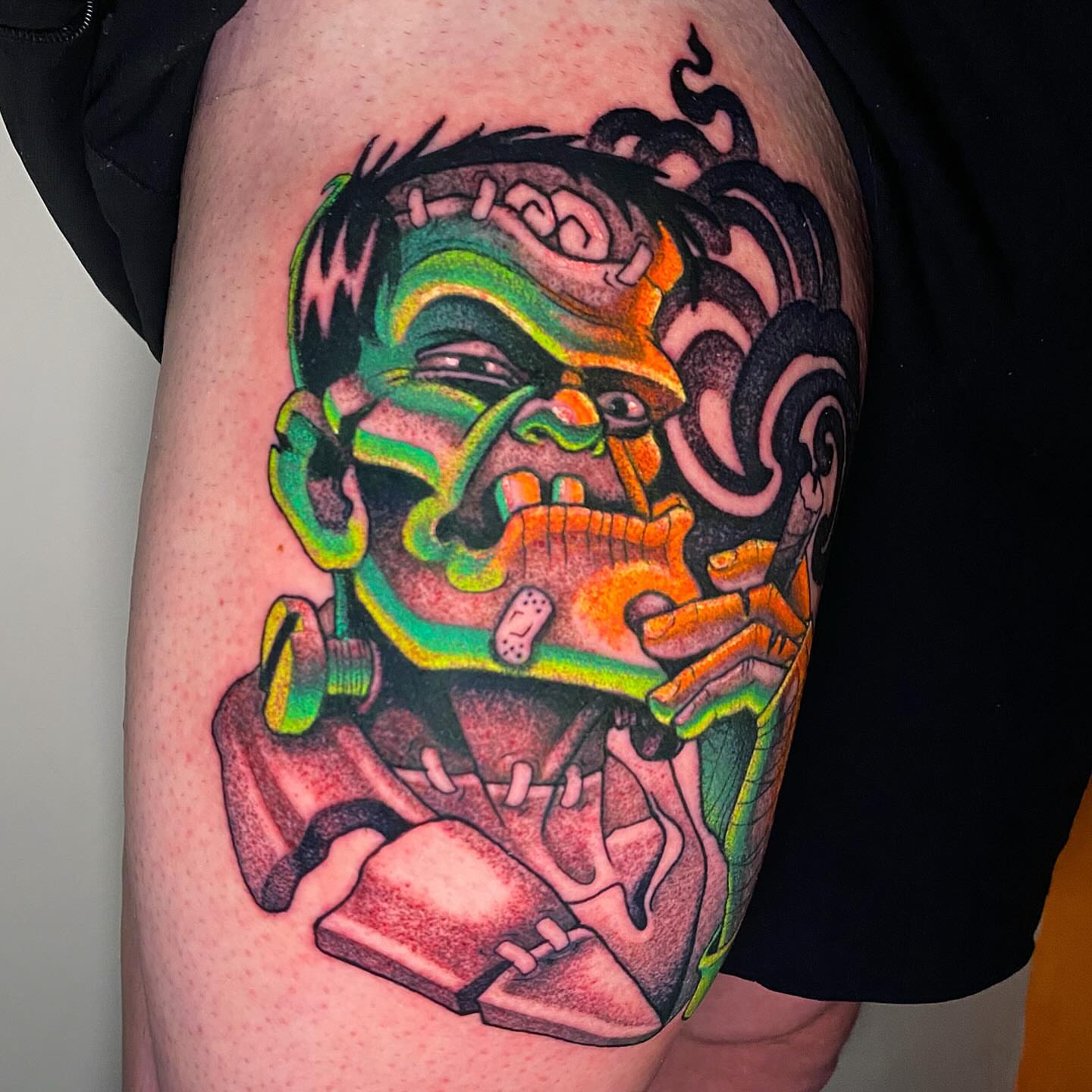 Frankenstein new school tattoo on the thigh by Lindsay Hall