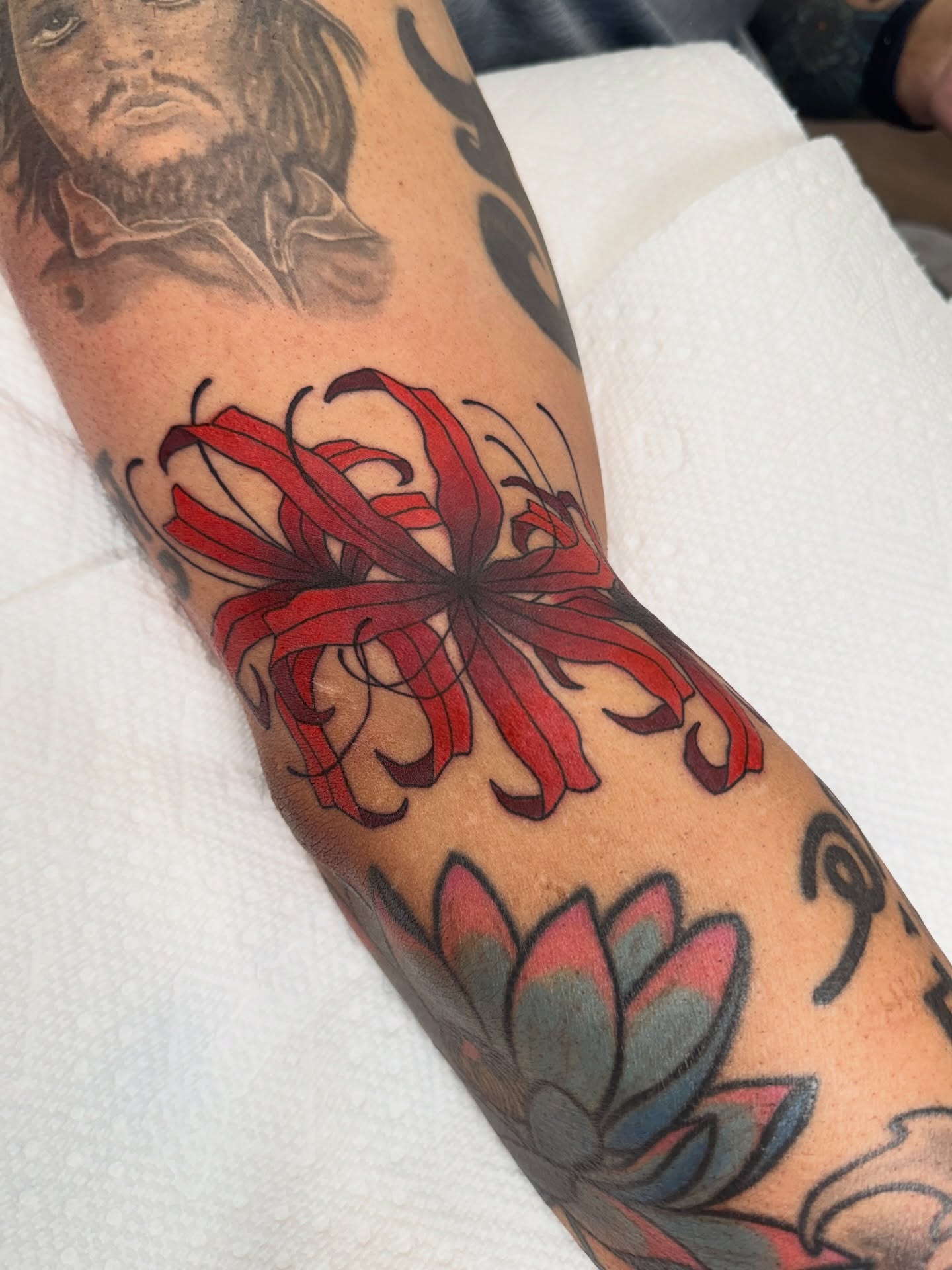 Red chrysanthemum japanese irezumi tattoo on the forearm by Christopher  Cousins, Nashville, Tennessee