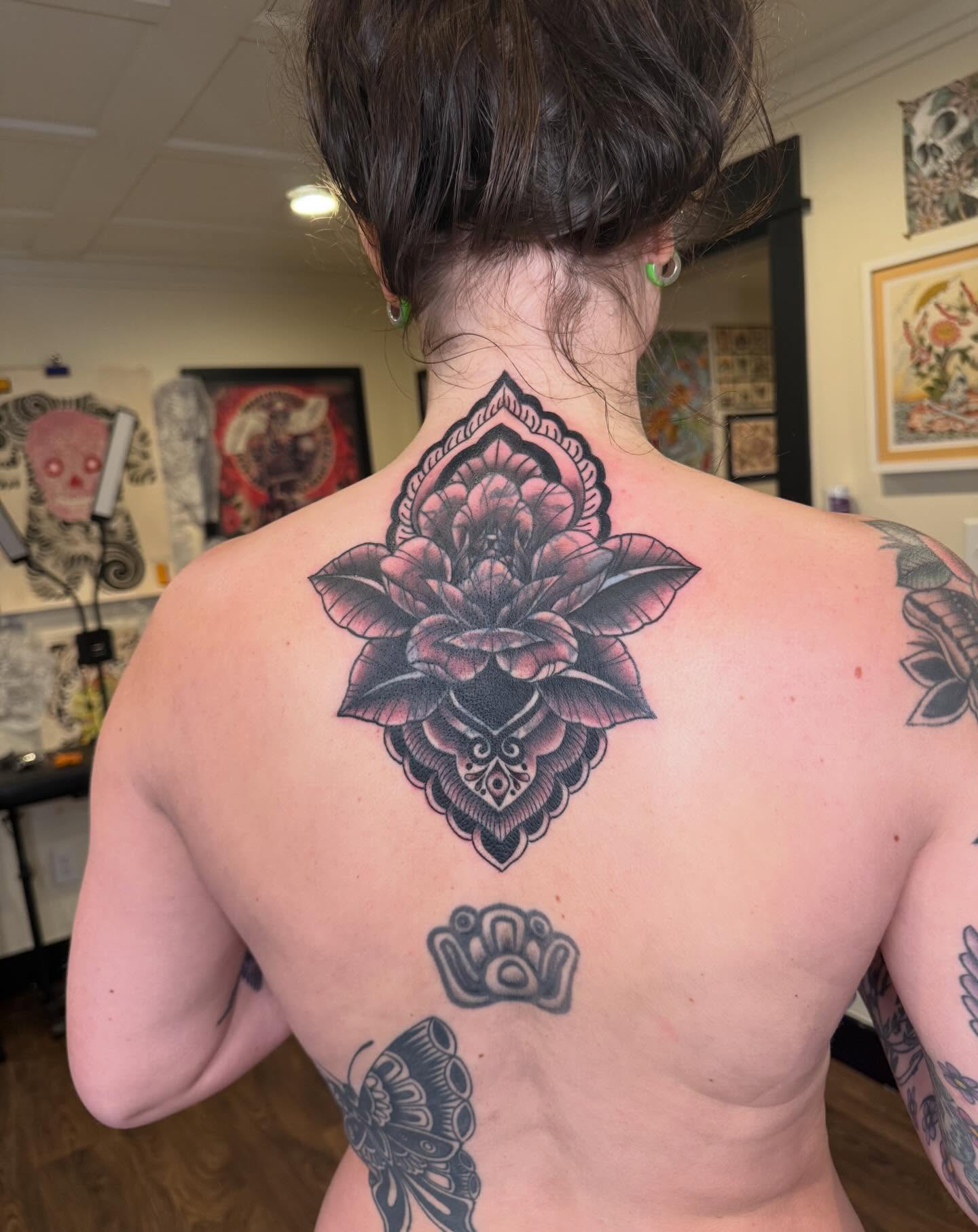 Lotus flower American traditional tattoo on the back by Rebecca Basma Smith