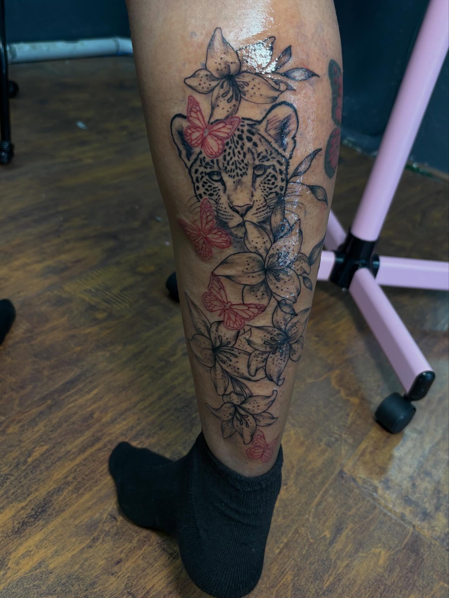 Leopard and flowers dotwork tattoo on the calf by addicted222inkk🎨