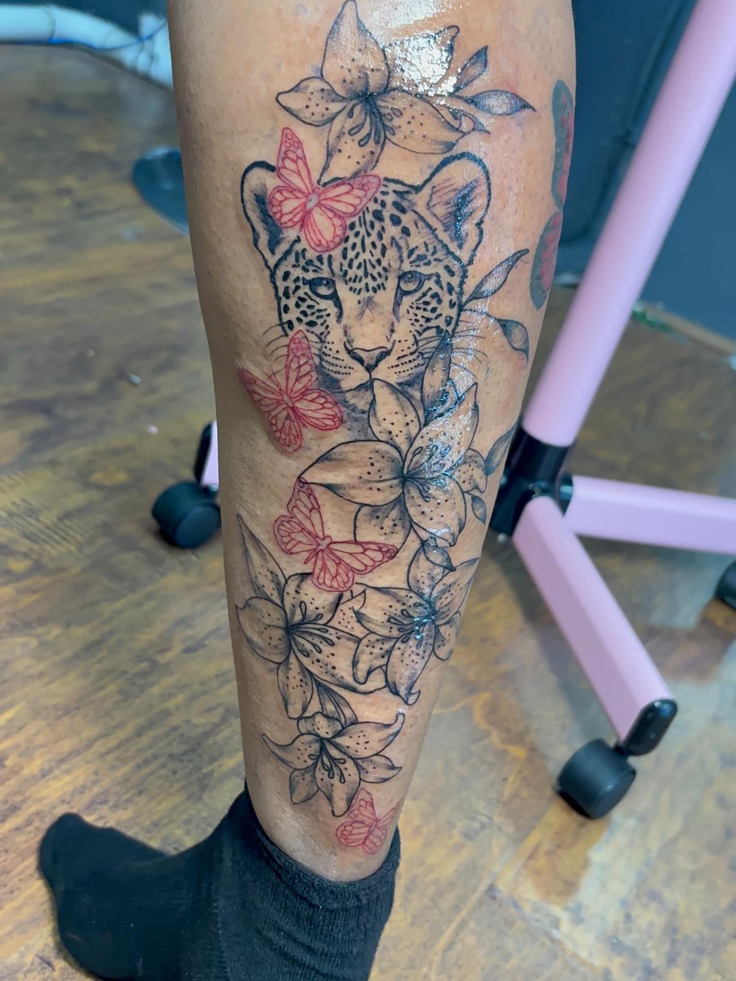 Leopard and flowers new school tattoo on the leg by addicted222inkk🎨
